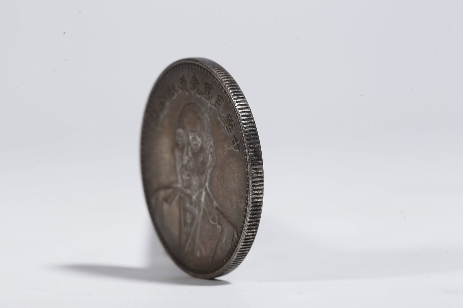 A SILVER DOLLAR COIN - 2