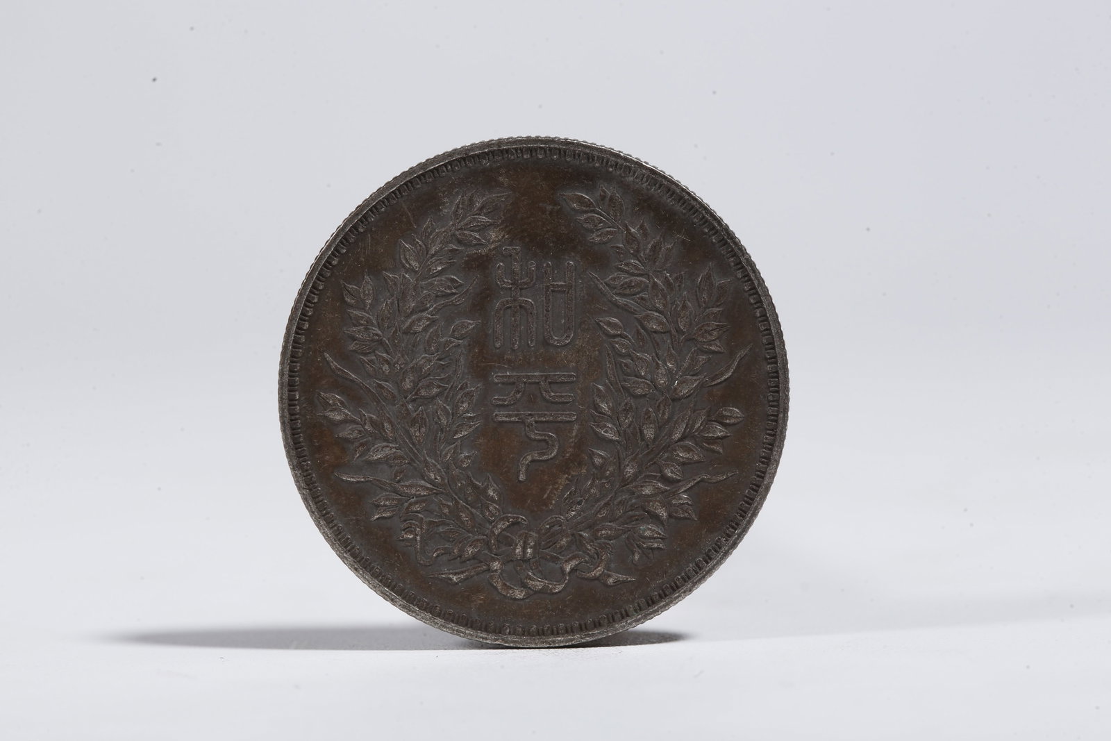 A SILVER DOLLAR COIN - 3