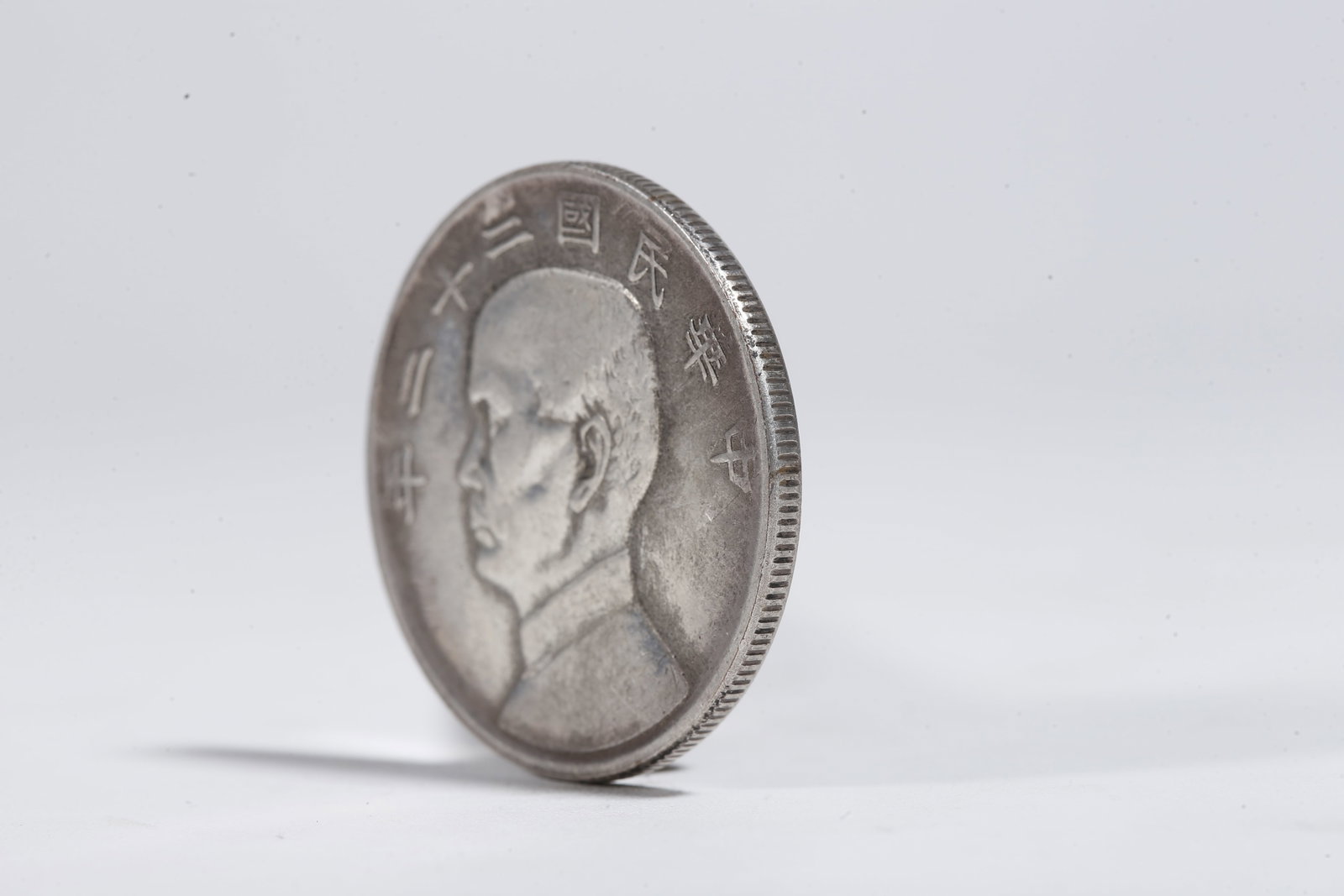 A SILVER DOLLAR COIN - 2