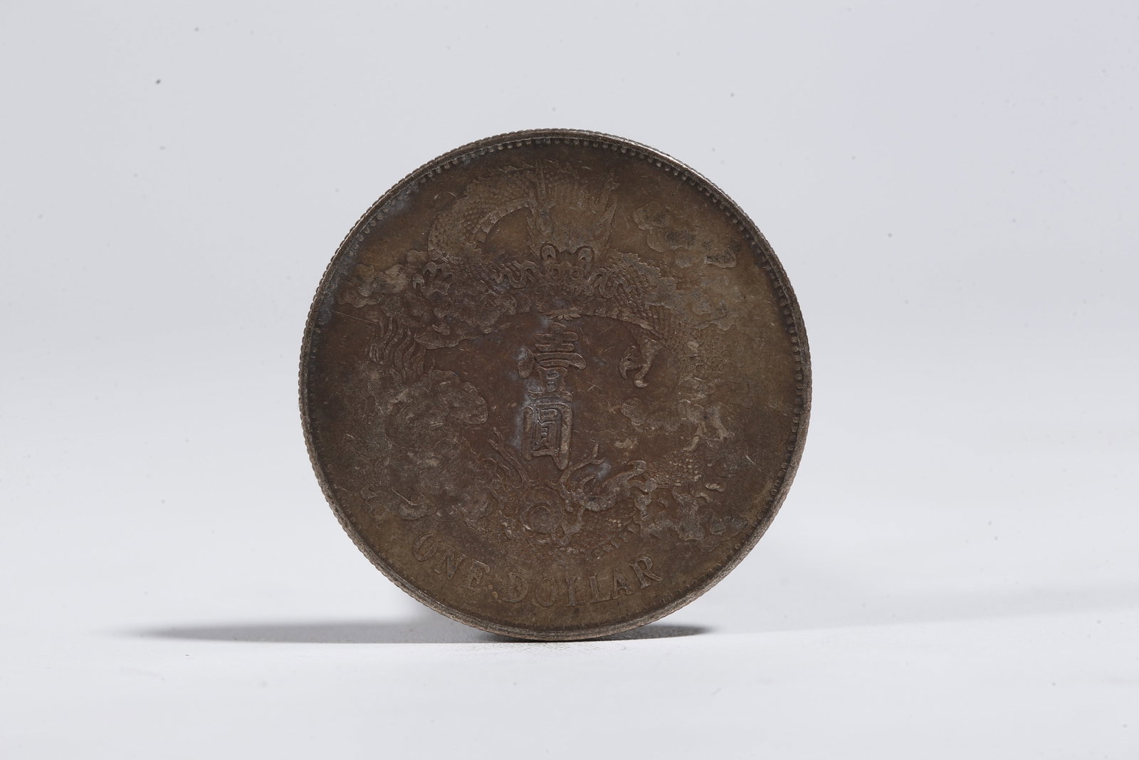 A SILVER DOLLAR COIN - 3