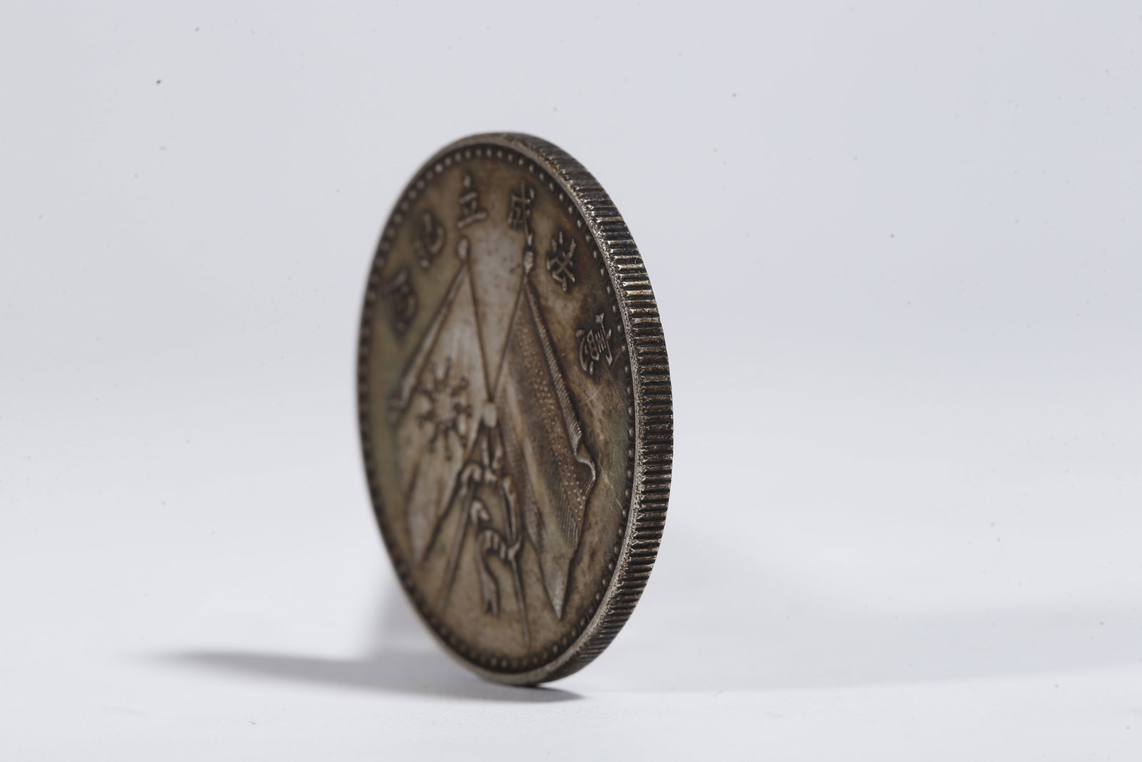 A SILVER DOLLAR COIN - 2