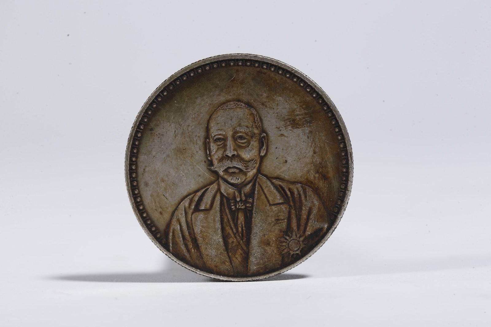 A SILVER DOLLAR COIN - 3