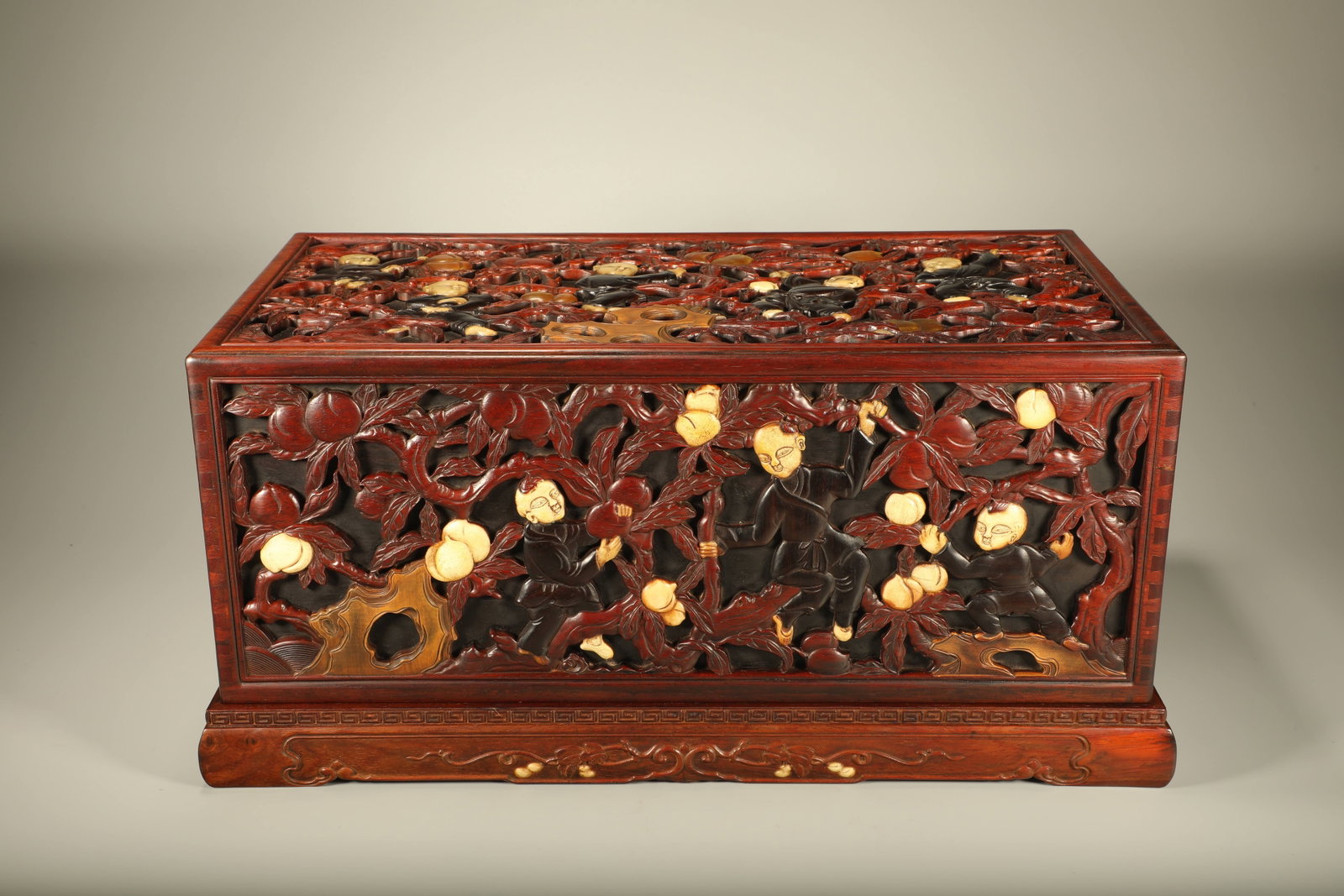 A HUANGHUALI WOOD SCHOLAR'S BOX INLAID WITH ZITAN AND HORN CARVING "FIVE SONS ATTAIN OFFICIAL RANK": Huanghuali Wood Scholar's Box Inlaid with Zitan and Horn Carving "Five Sons Attain Official Rank"