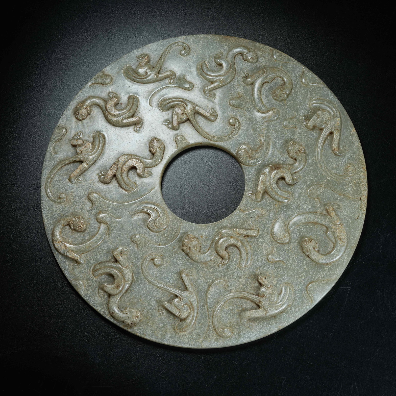 A ANCIENT JADE BI DISC CARVED WITH CHI DRAGON PATTERNS: Ancient Jade Bi Disc Carved with Chi Dragon Patterns