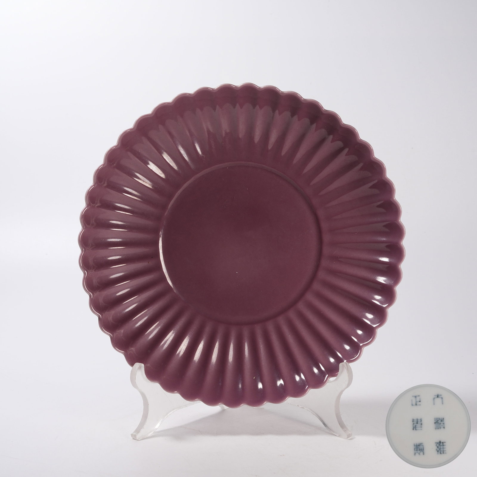 A CARMINE GLAZED CHRYSANTHEMUM PETAL PLATE: Carmine Glazed Chrysanthemum Petal Plate