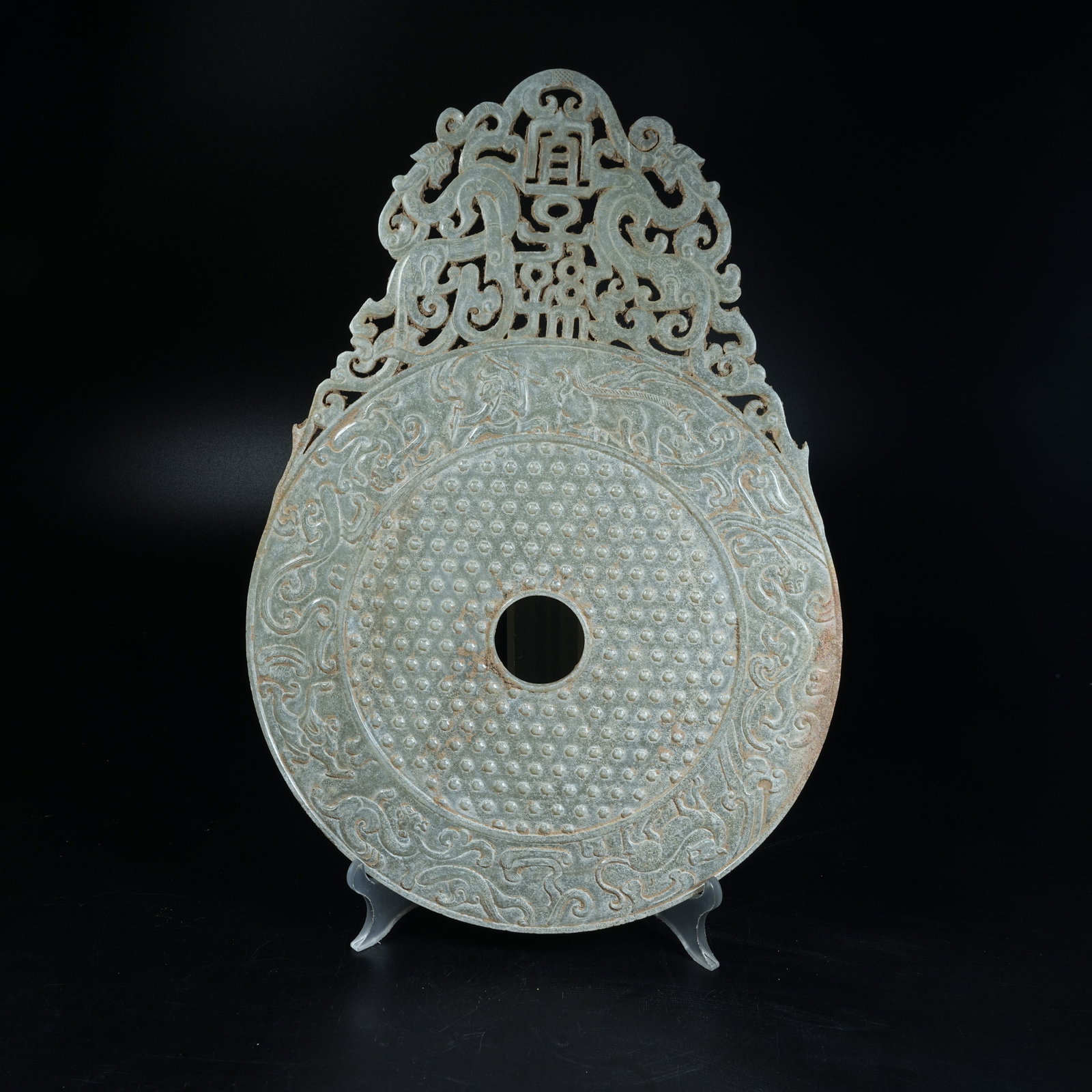 A ANCIENT JADE OPENWORK BI DISC WITH HUNTING SCENE AND BLESSINGS FOR DESCENDANTS EXTENDING BEYOND: Ancient Jade Openwork Bi Disc with Hunting Scene and Blessings for Descendants Extending Beyond Rim