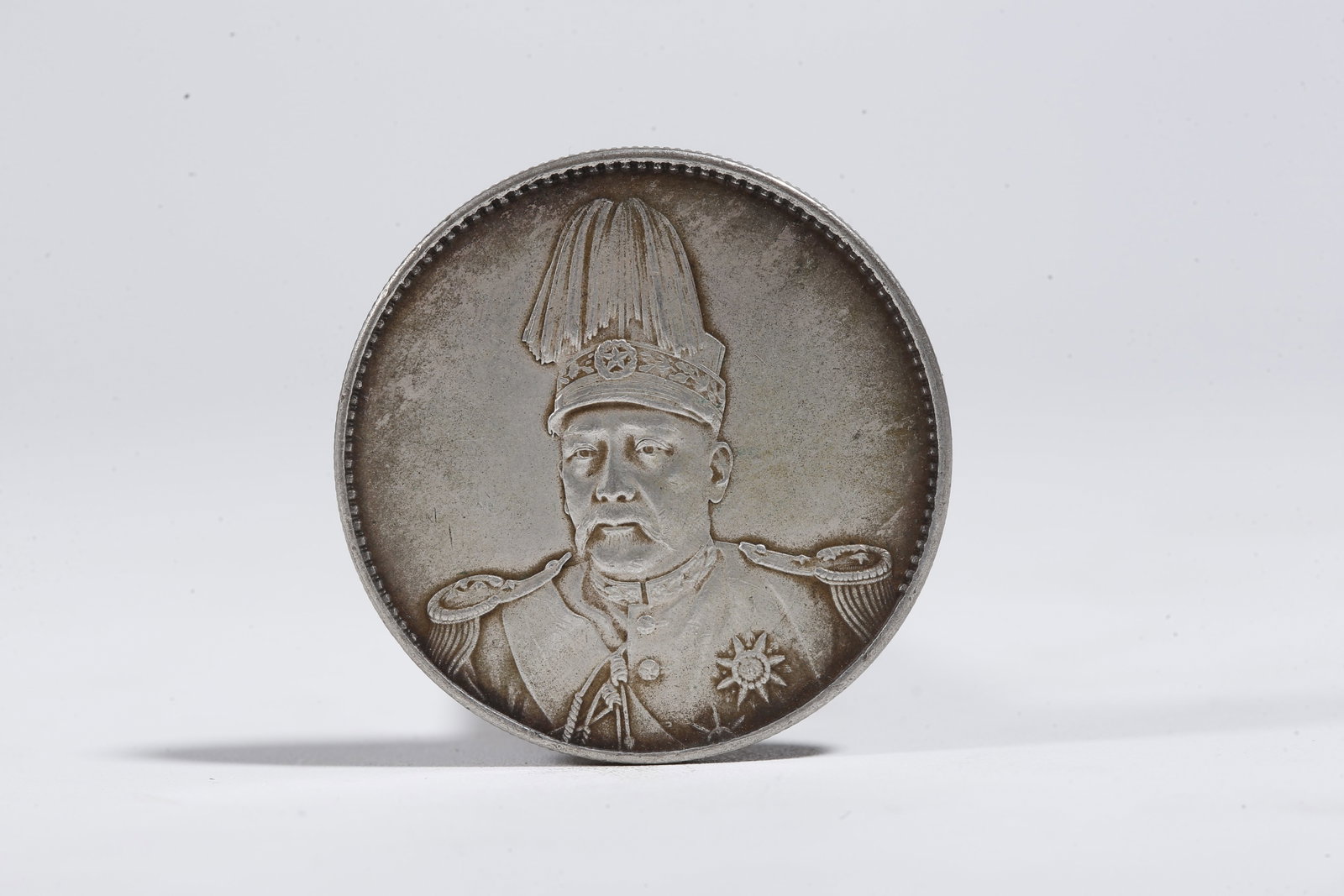 A SILVER DOLLAR COIN - 3