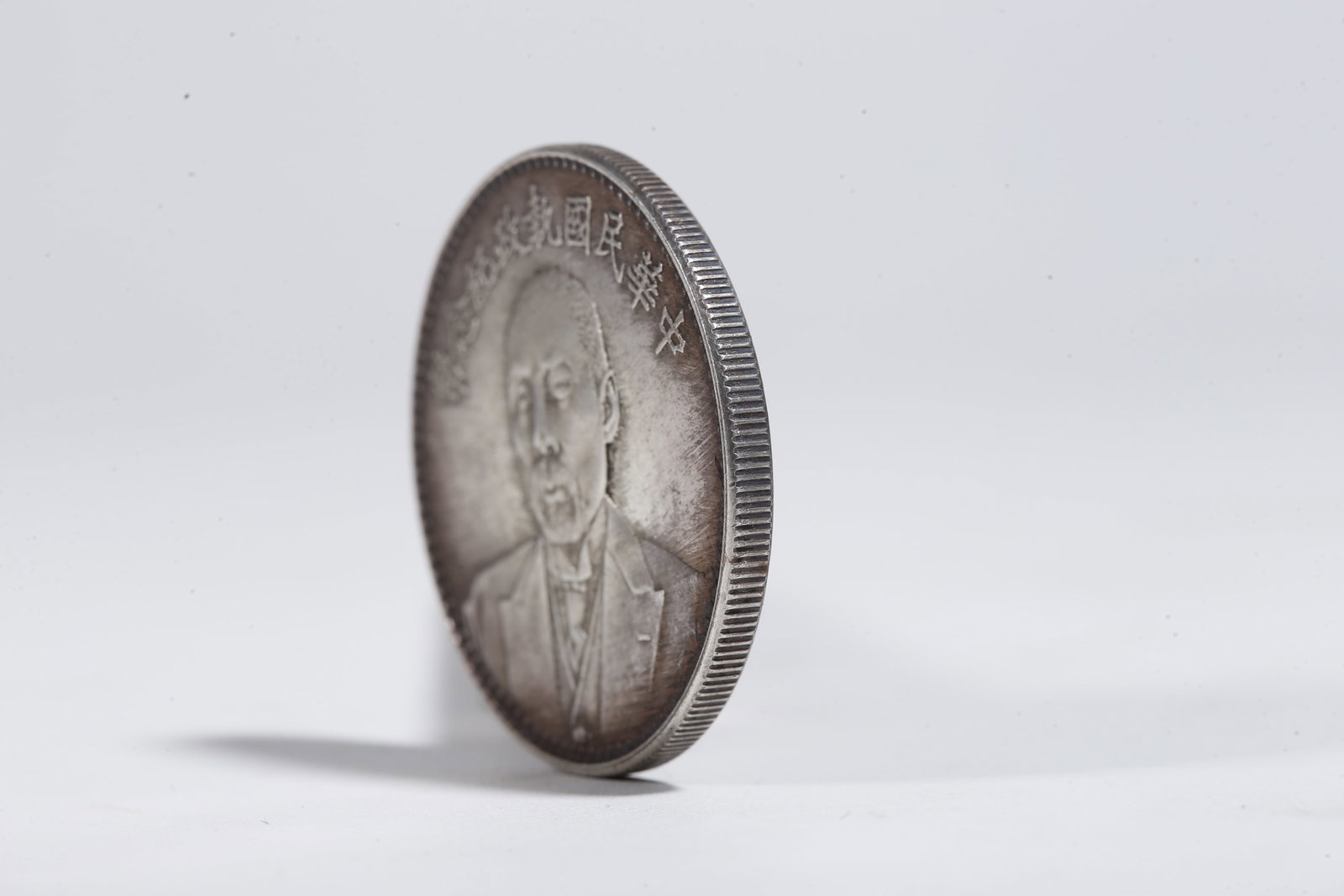 A SILVER DOLLAR COIN - 2
