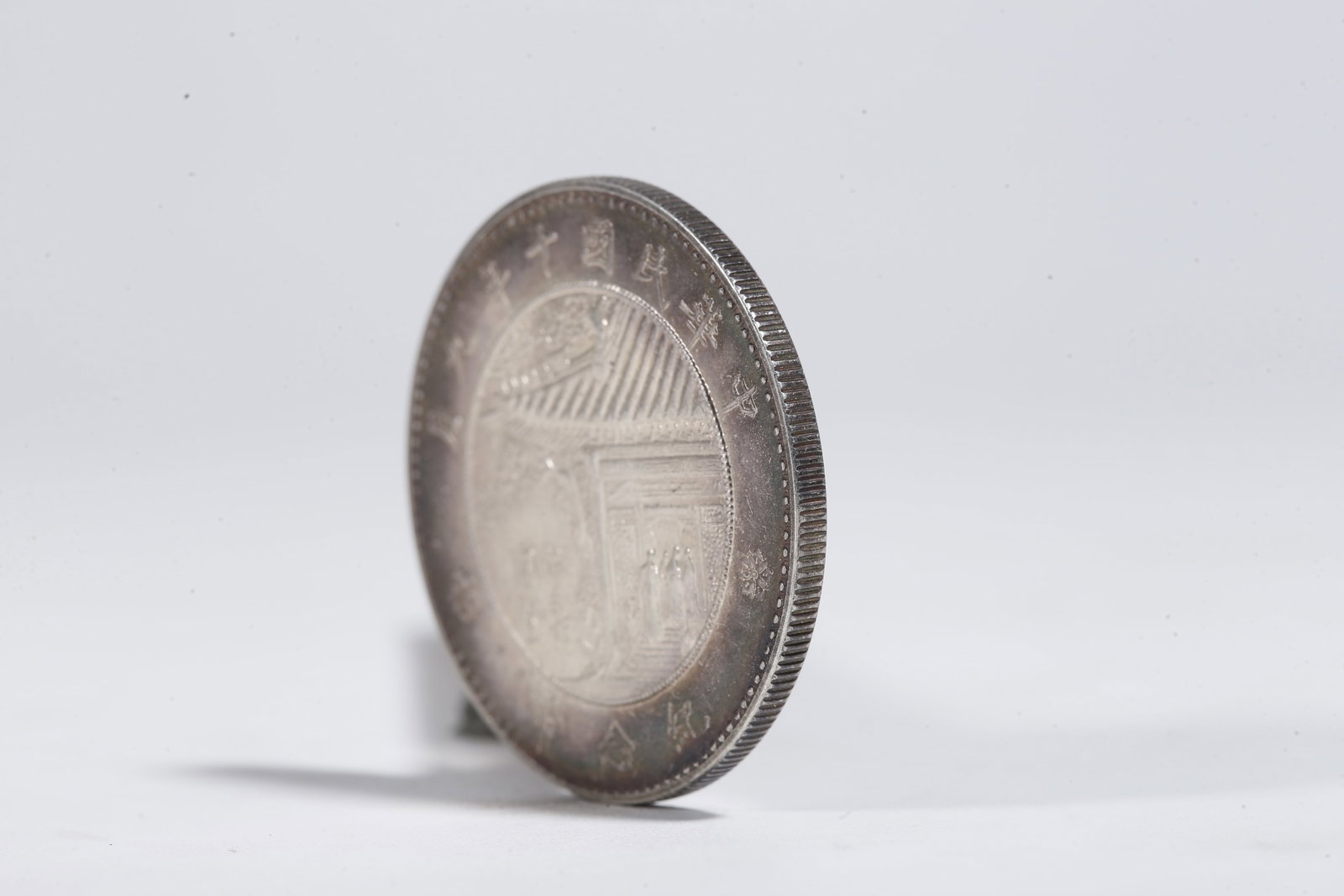 A SILVER DOLLAR COIN - 2