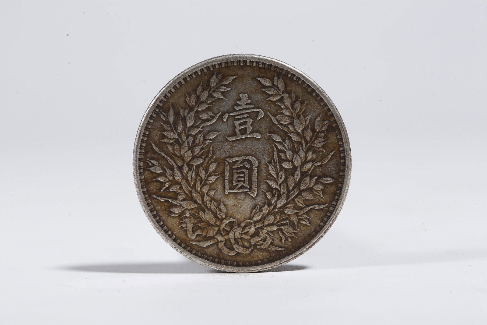 A SILVER DOLLAR COIN - 3