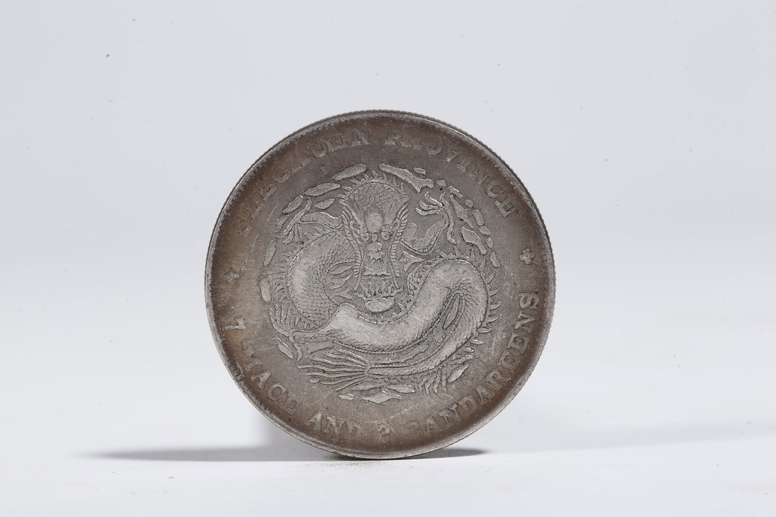 A SILVER DOLLAR COIN - 3