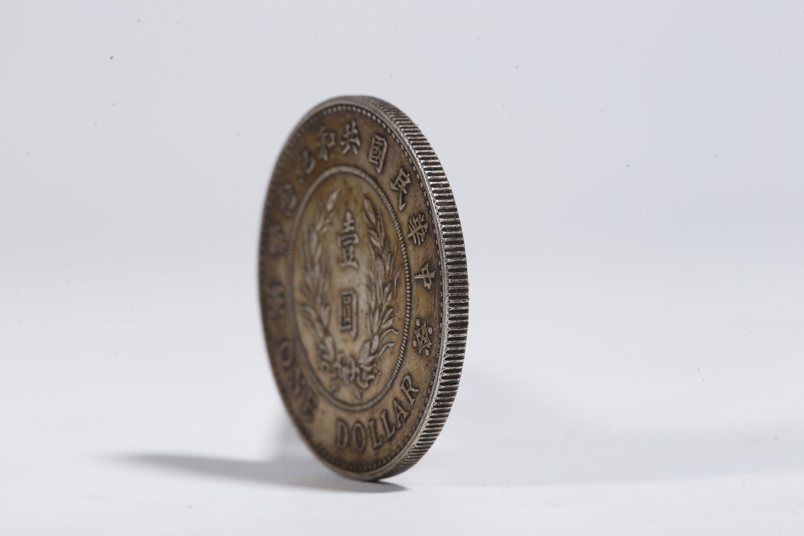 A SILVER DOLLAR COIN - 2