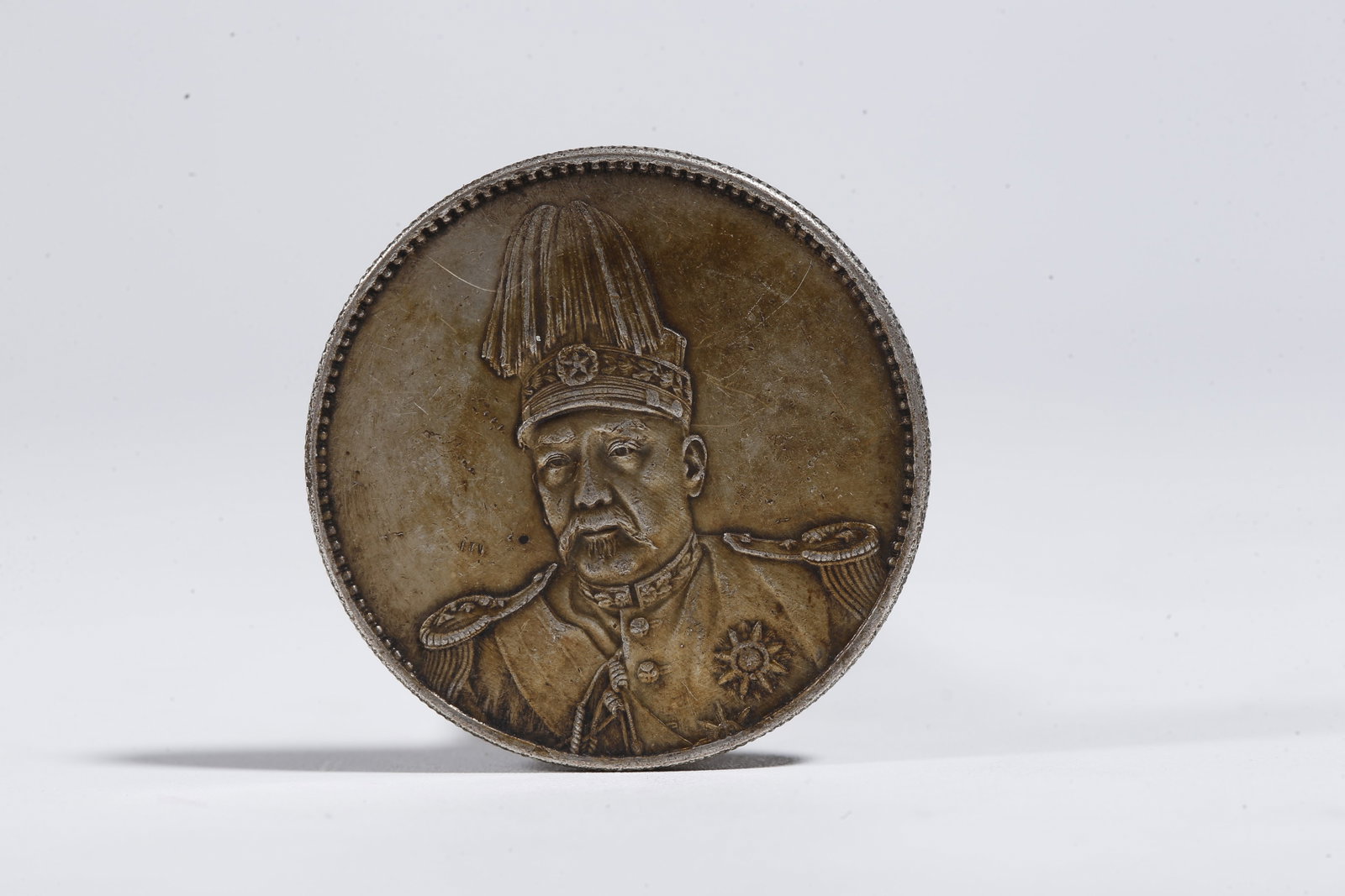 A SILVER DOLLAR COIN - 3