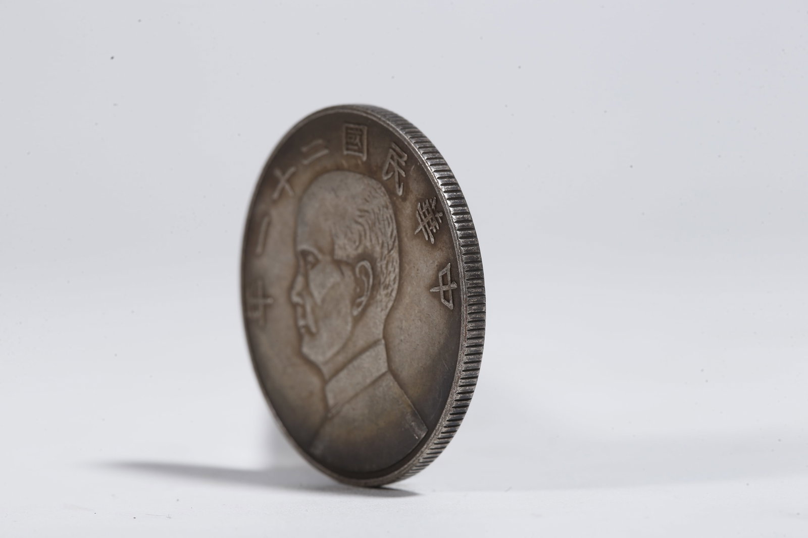 A SILVER DOLLAR COIN - 2