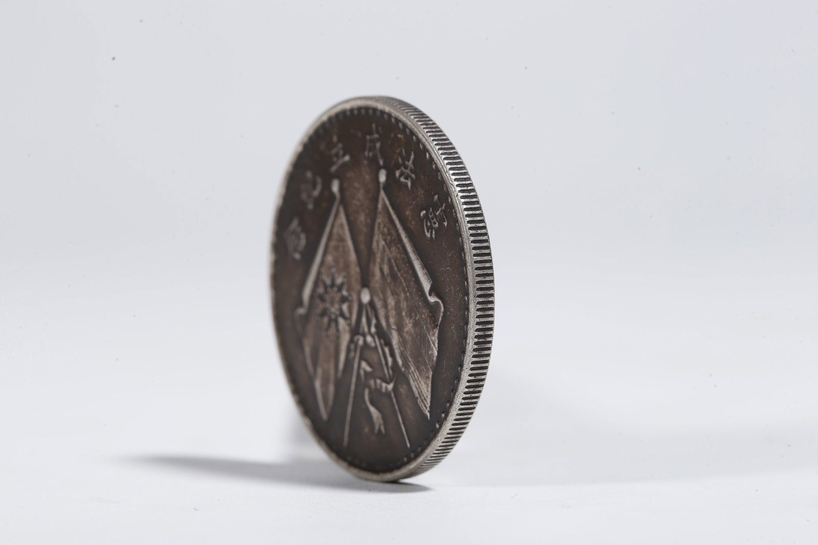 A SILVER DOLLAR COIN - 2