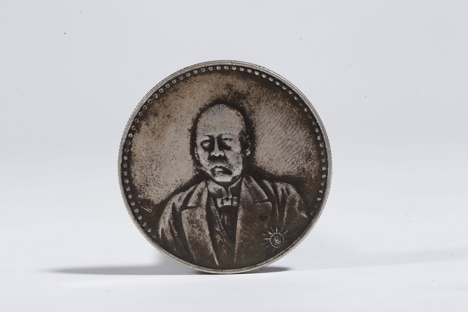 A SILVER DOLLAR COIN - 3