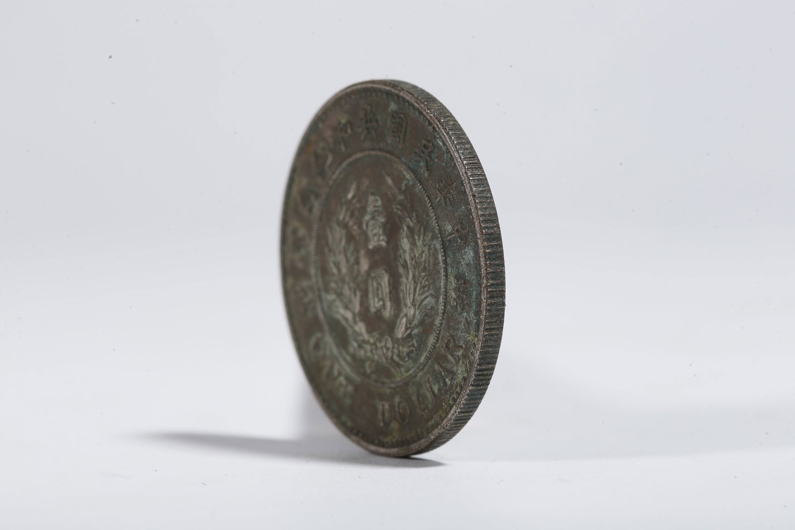 A SILVER DOLLAR COIN - 2