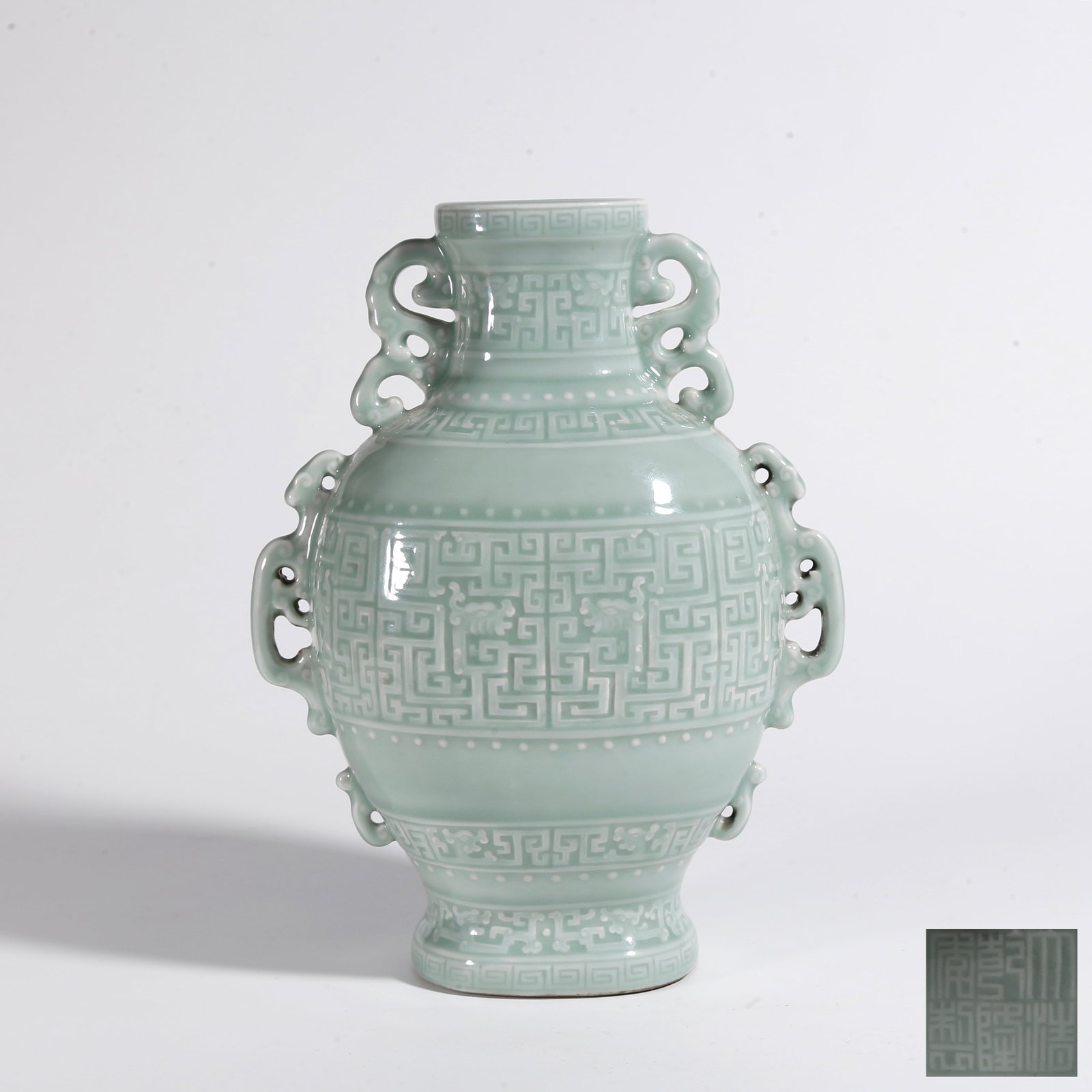 A PEA GREEN GLAZE KUI DRAGON PATTERN TWO-EARED VASE: Pea Green Glaze Kui Dragon Pattern Two-Eared Vase