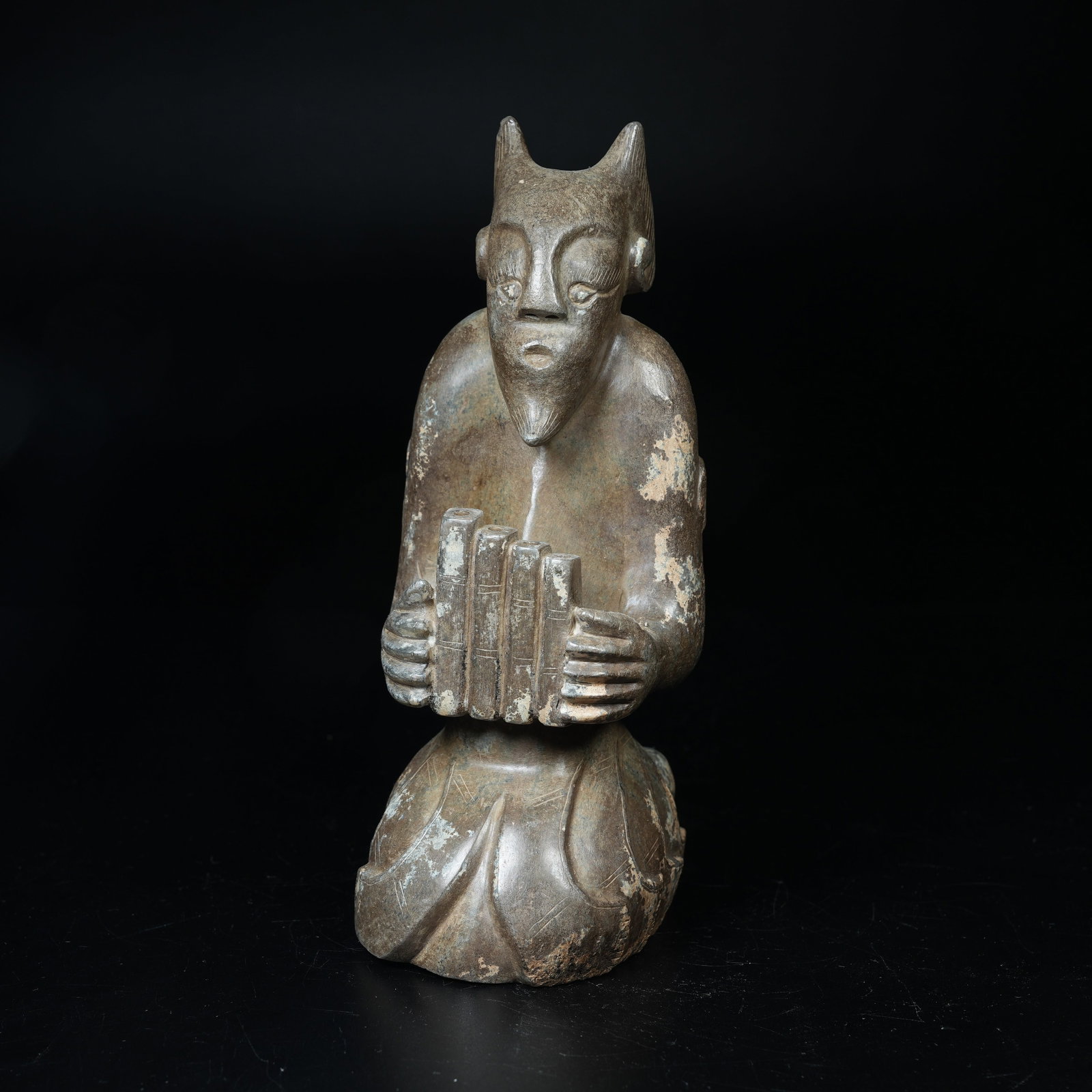 A ARCHAIC JADE MUSICIAN FIGURINE: Archaic Jade Musician Figurine