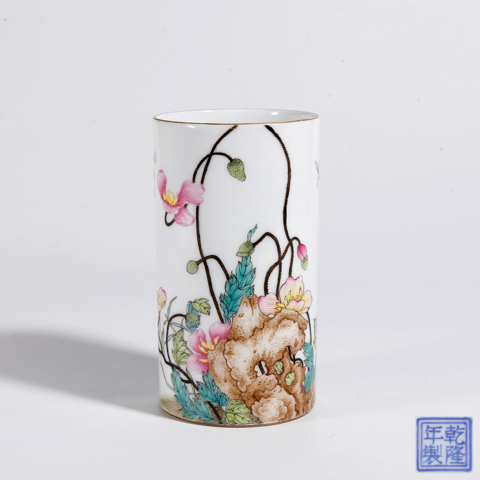 A FAMILLE ROSE ROCK, FLOWER AND BUTTERFLY PATTERN BRUSH POT: Famille Rose Rock, Flower and Butterfly Pattern Brush Pot