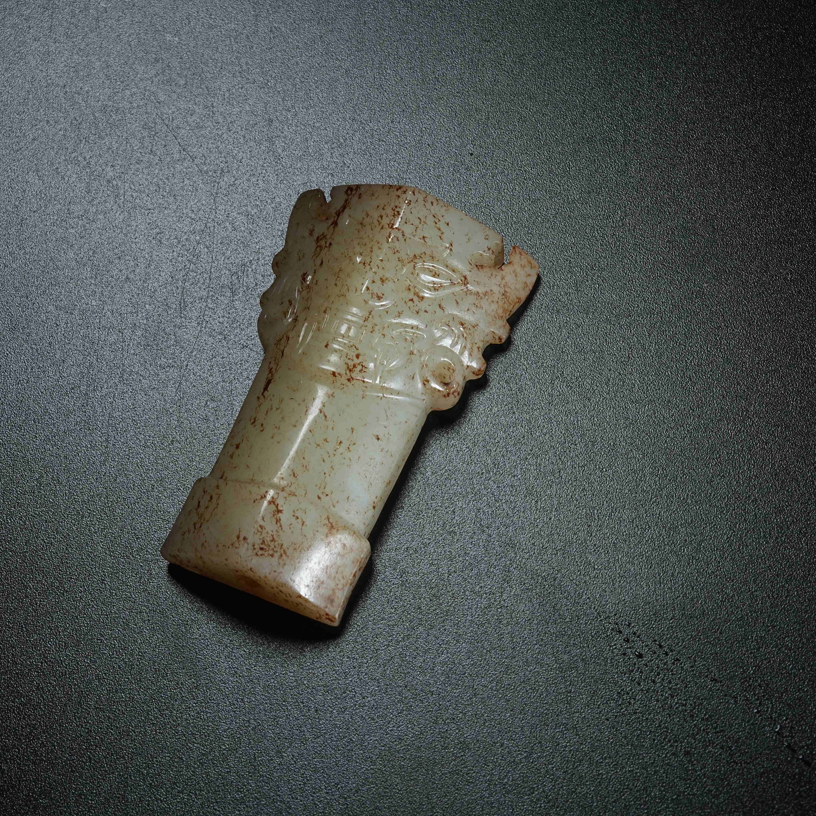 A ARCHAIC JADE PENDANT WITH DIVINE HUMAN FACE: Archaic Jade Pendant with Divine Human Face