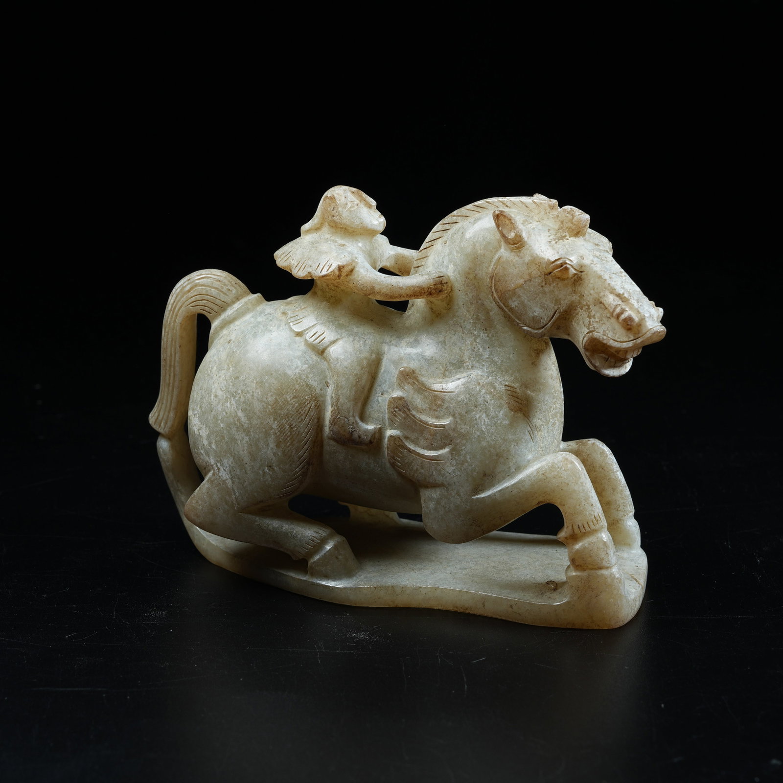A ANCIENT JADE ORNAMENT OF FEATHERED MAN RIDING HORSE (1 of 8)