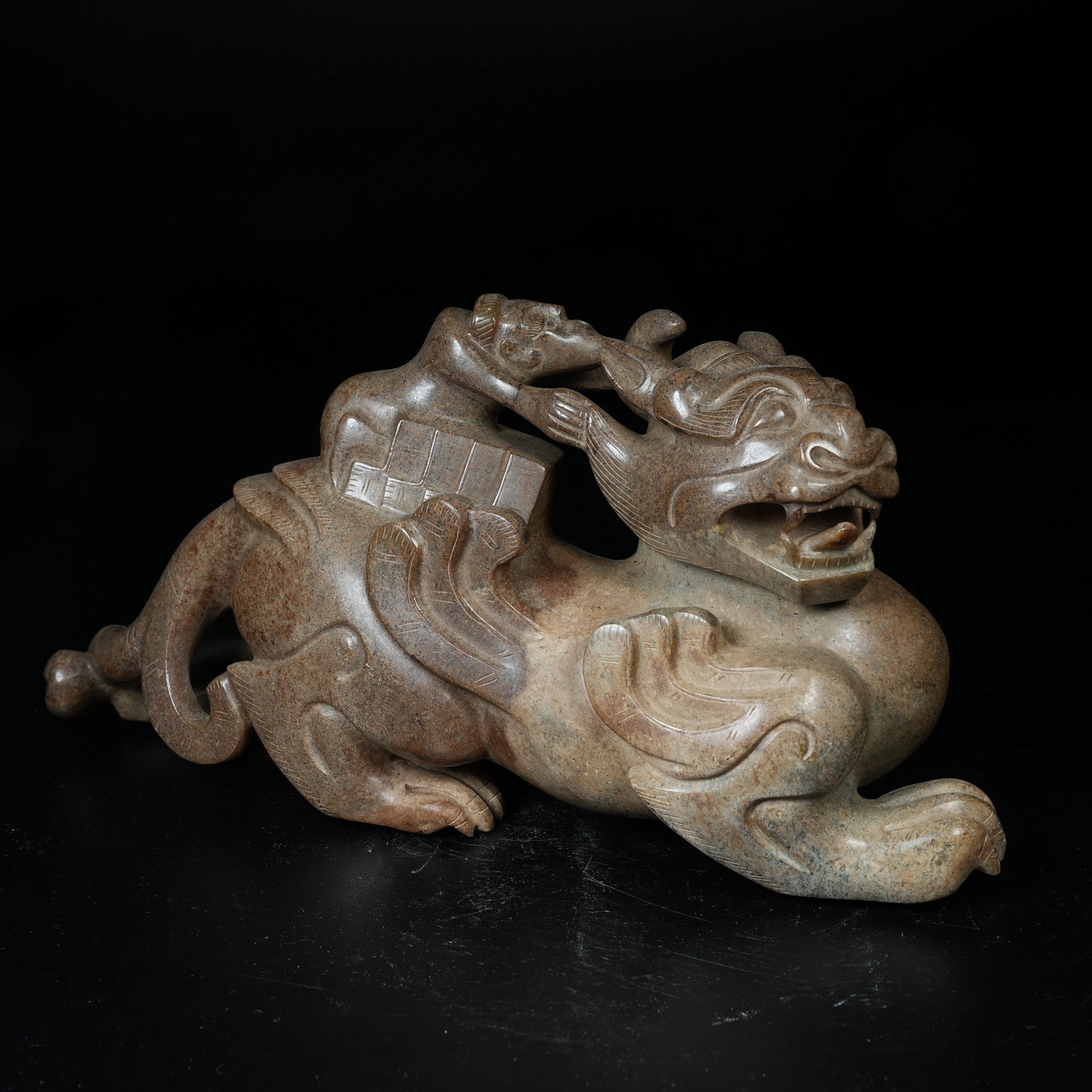 A ARCHAIC JADE ORNAMENT OF DIVINE IMMORTAL RIDING BEAST: Archaic Jade Ornament of Divine Immortal Riding Beast