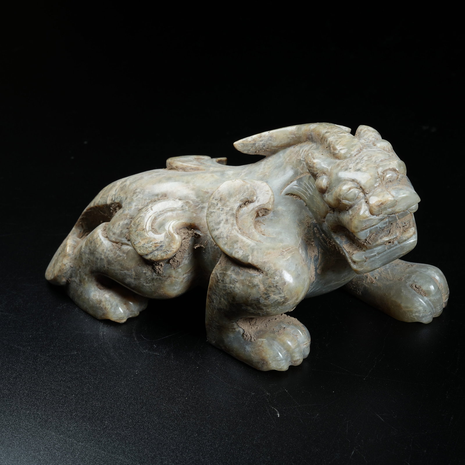 A ANCIENT JADE RECLINING BEAST ORNAMENT (1 of 8)