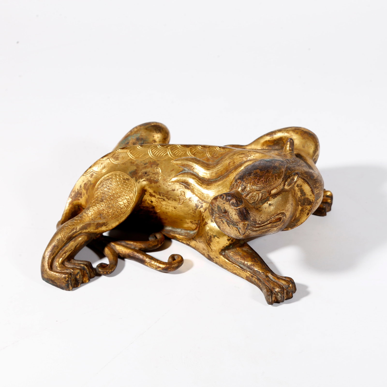 A GILT BRONZE BEAST-SHAPED ORNAMENT: Gilt Bronze Beast-shaped Ornament