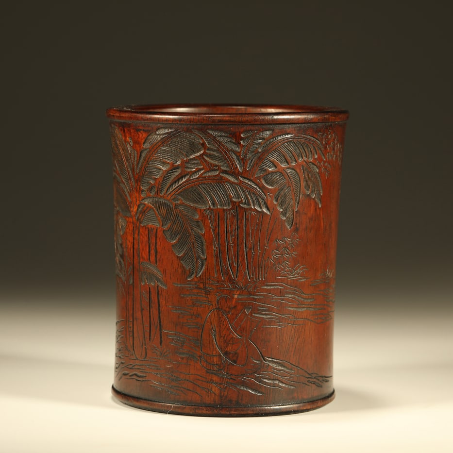 A HUANGHUALI WOOD CARVED BRUSH POT WITH PLANTAIN LEAVES AND FIGURES: Huanghuali Wood Carved Brush Pot with Plantain Leaves and Figures