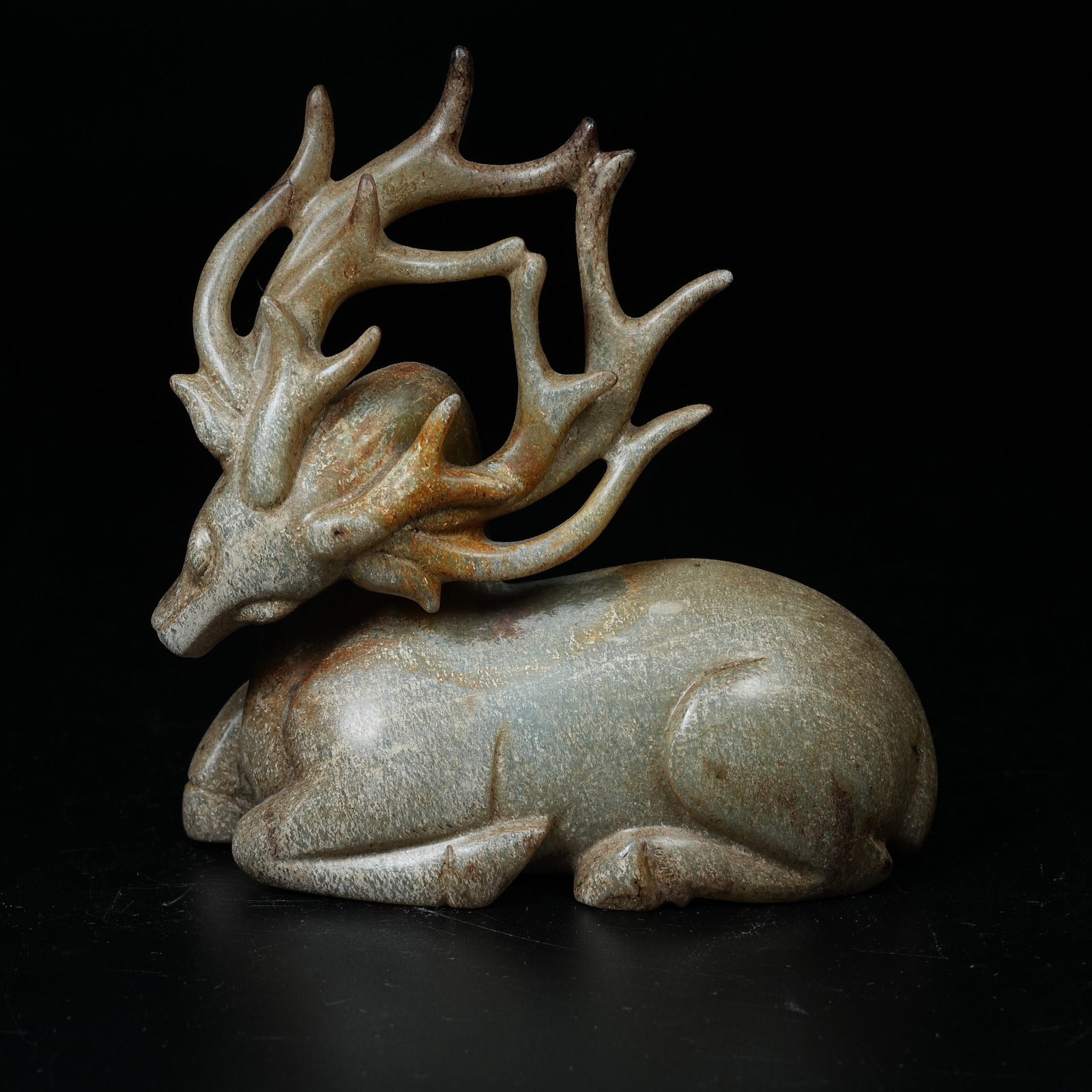 A ARCHAIC JADE RECUMBENT DEER ORNAMENT: Archaic Jade Recumbent Deer Ornament
