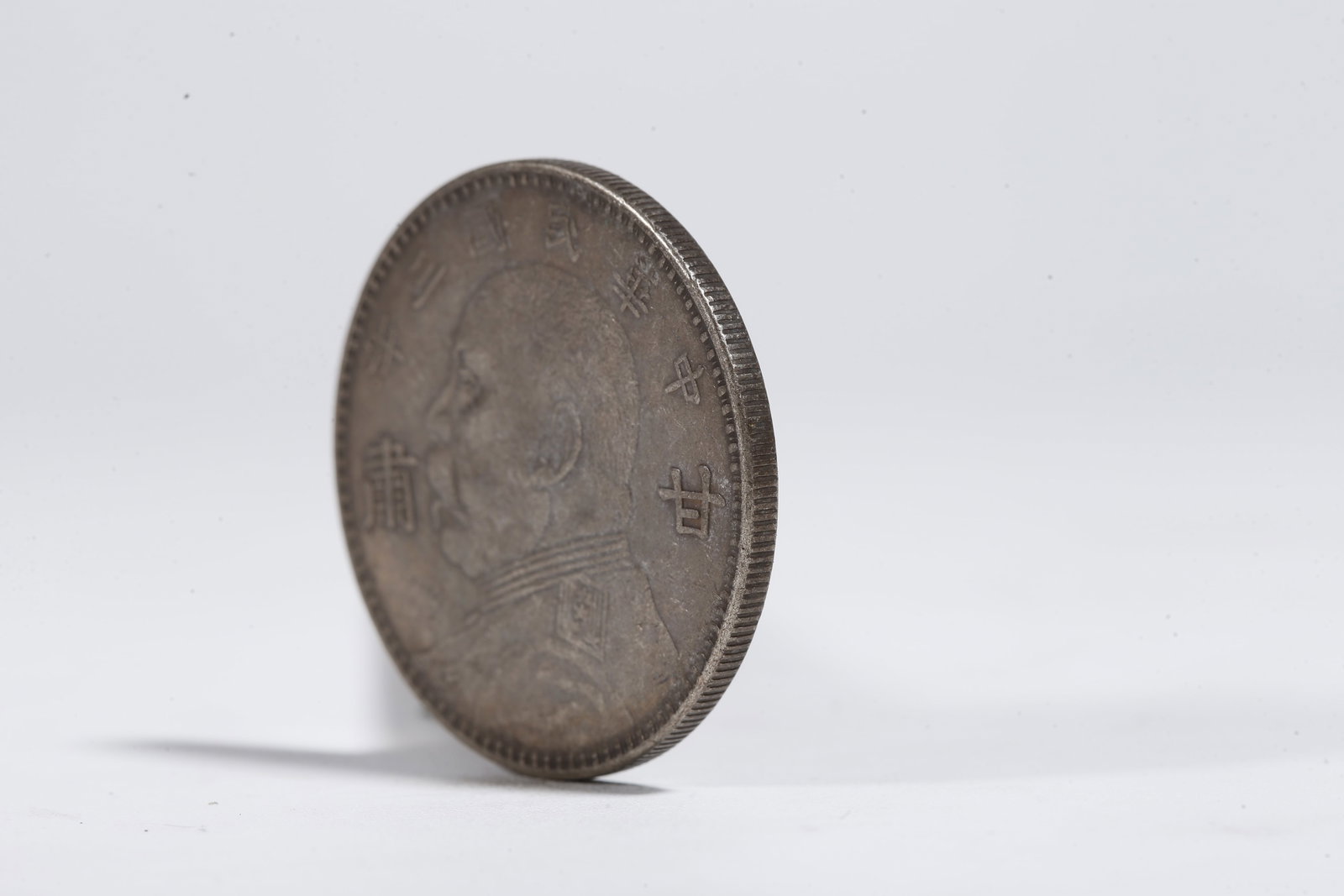A SILVER DOLLAR COIN - 2