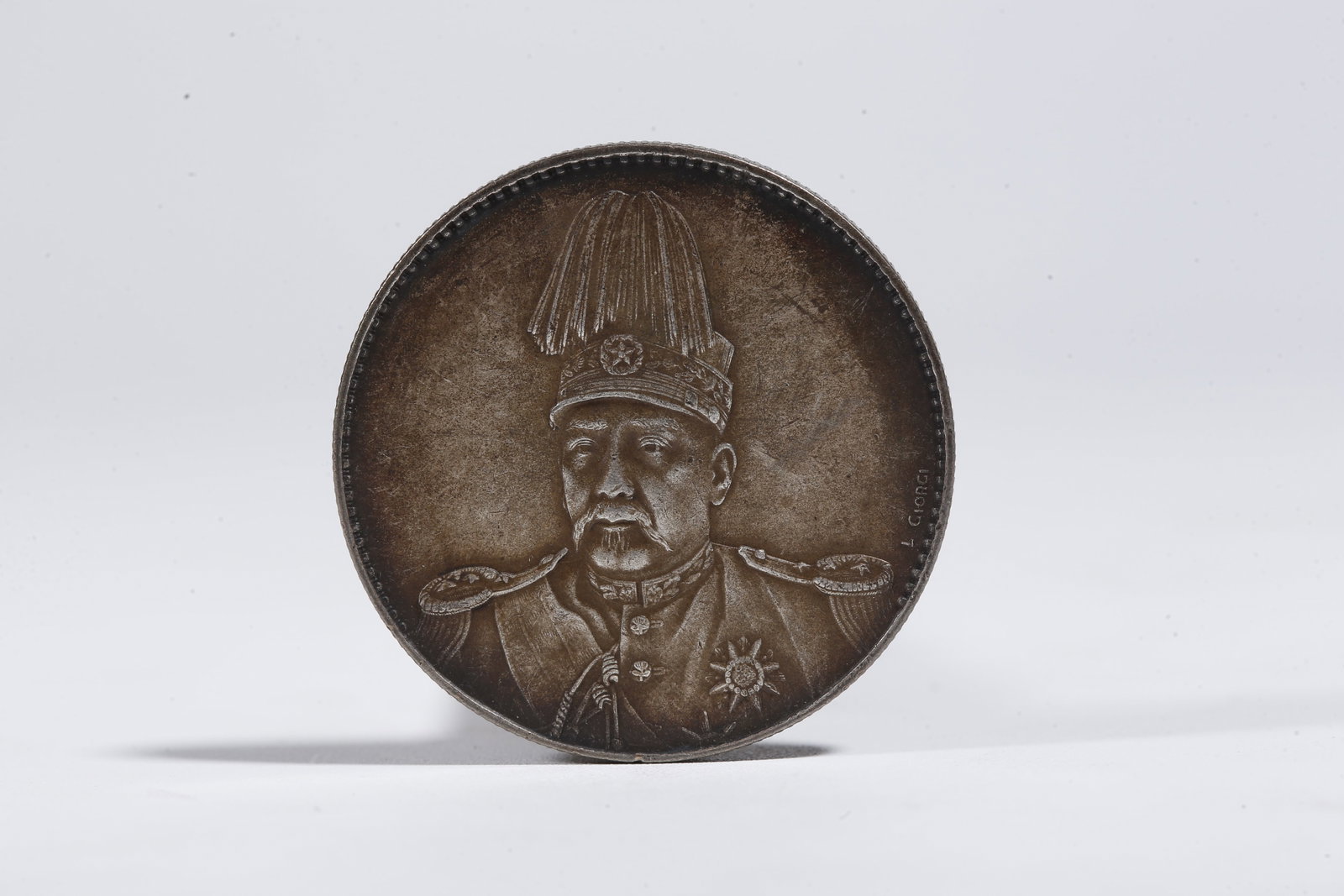 A SILVER DOLLAR COIN - 3