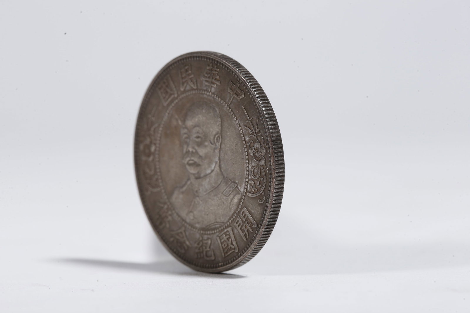 A SILVER DOLLAR COIN - 2