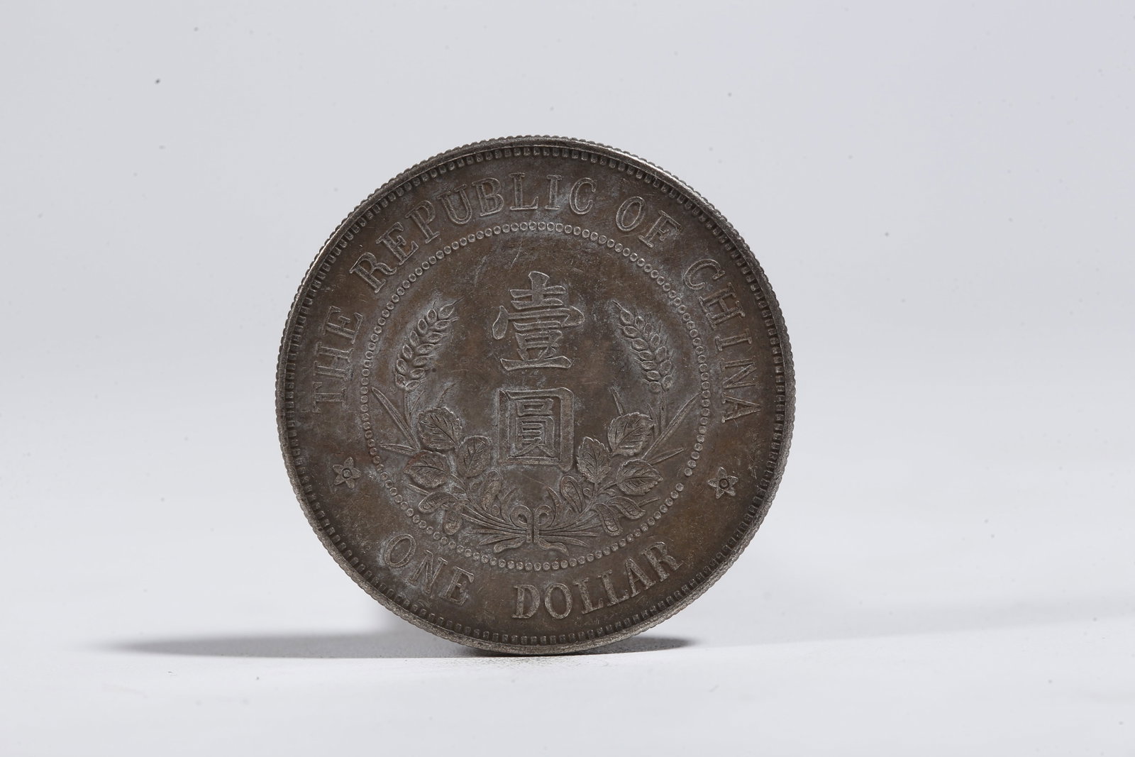 A SILVER DOLLAR COIN - 3