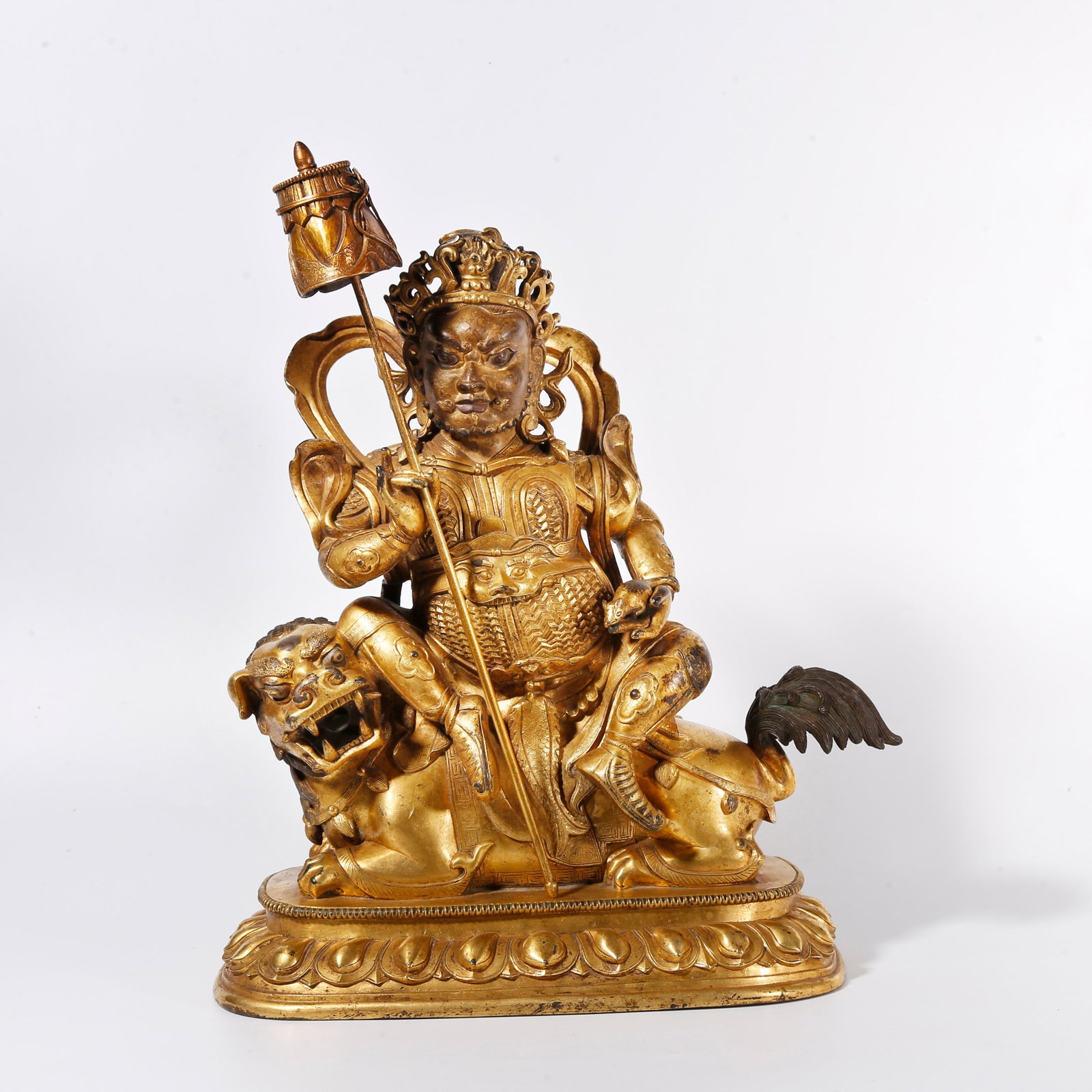 A GILT BRONZE STATUE OF VAISHRAVANA: Gilt Bronze Statue of Vaishravana