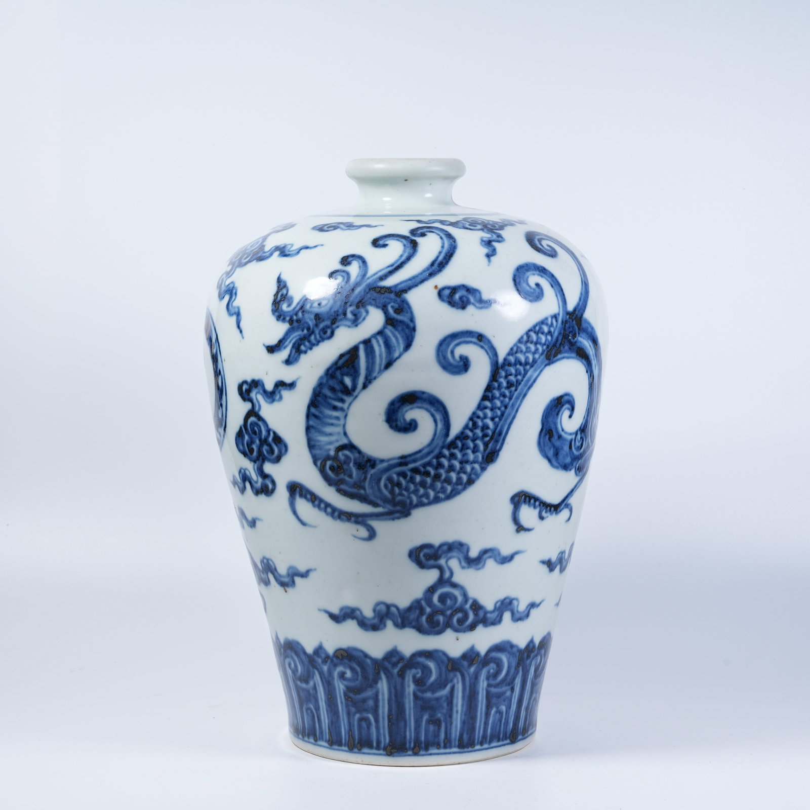 A PLUM VASE WITH BLUE AND WHITE MAKARA PATTERNS: Plum Vase with Blue and White Makara Patterns
