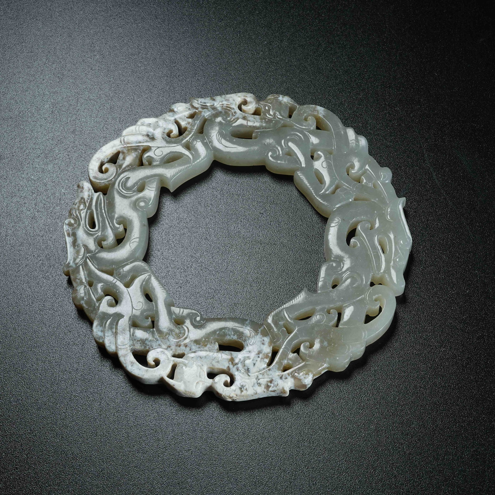 A ARCHAIC JADE BI DISC WITH DRAGON MOTIFS: Archaic Jade Bi Disc with Dragon Motifs