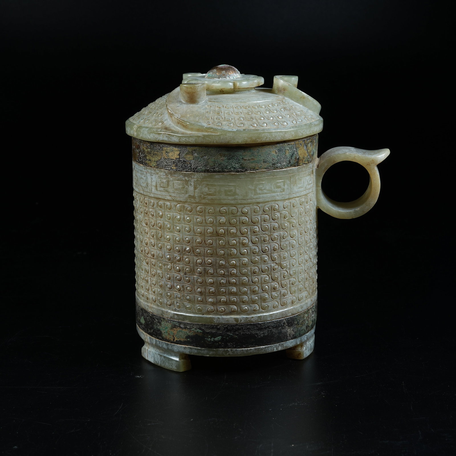A ANCIENT JADE SLENDER CUP CARVED WITH HOOKED CLOUD PATTERNS: Ancient Jade Slender Cup Carved with Hooked Cloud Patterns