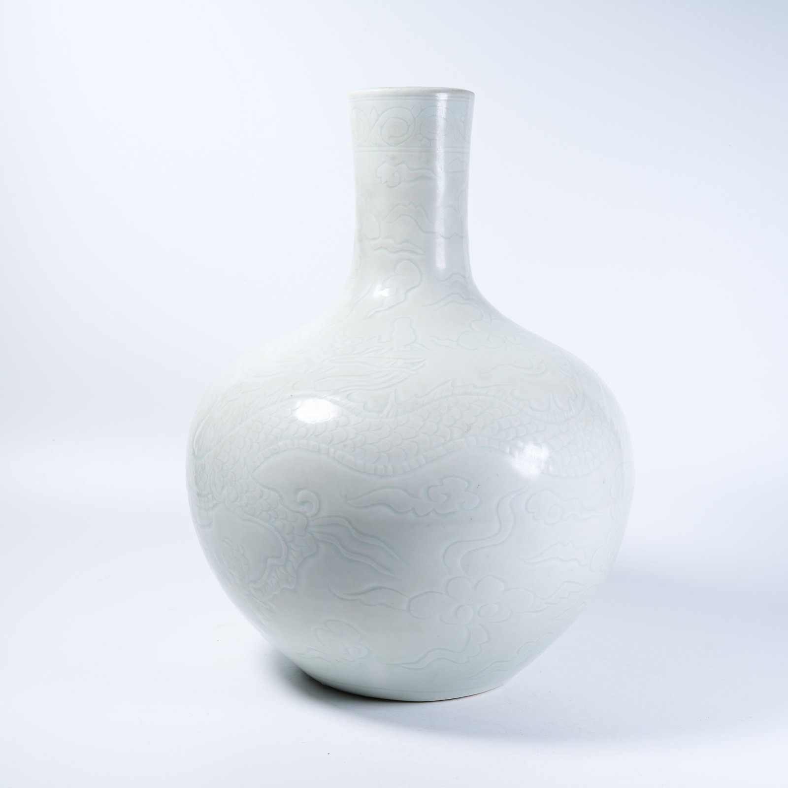 A CELESTIAL SPHERE VASE WITH WHITE GLAZE SECRET CARVED CLOUD DRAGON PATTERNS: Celestial Sphere Vase with White Glaze Secret Carved Cloud Dragon Patterns