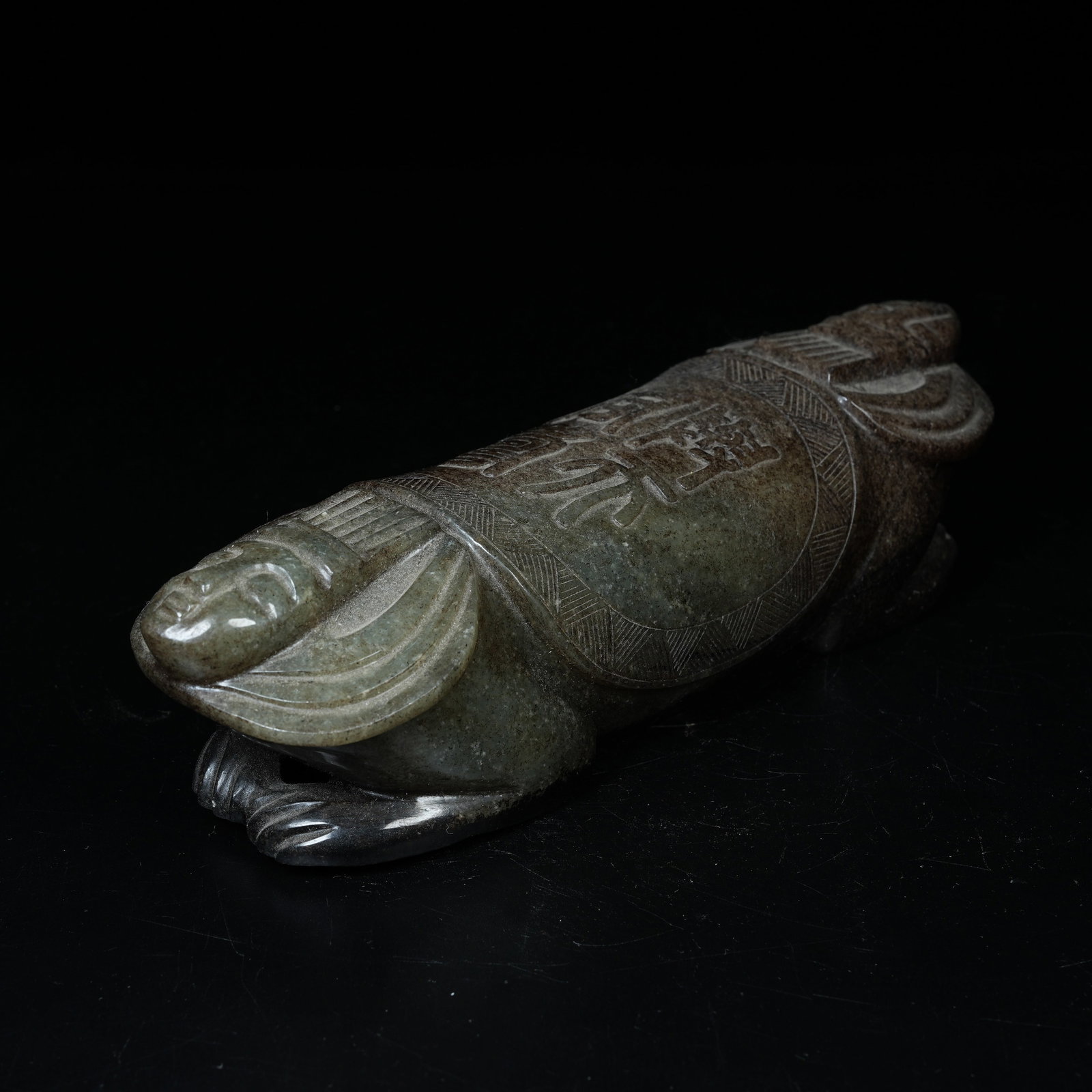A ARCHAIC JADE PILLOW WITH TWIN IMMORTAL FIGURES: Archaic Jade Pillow with Twin Immortal Figures