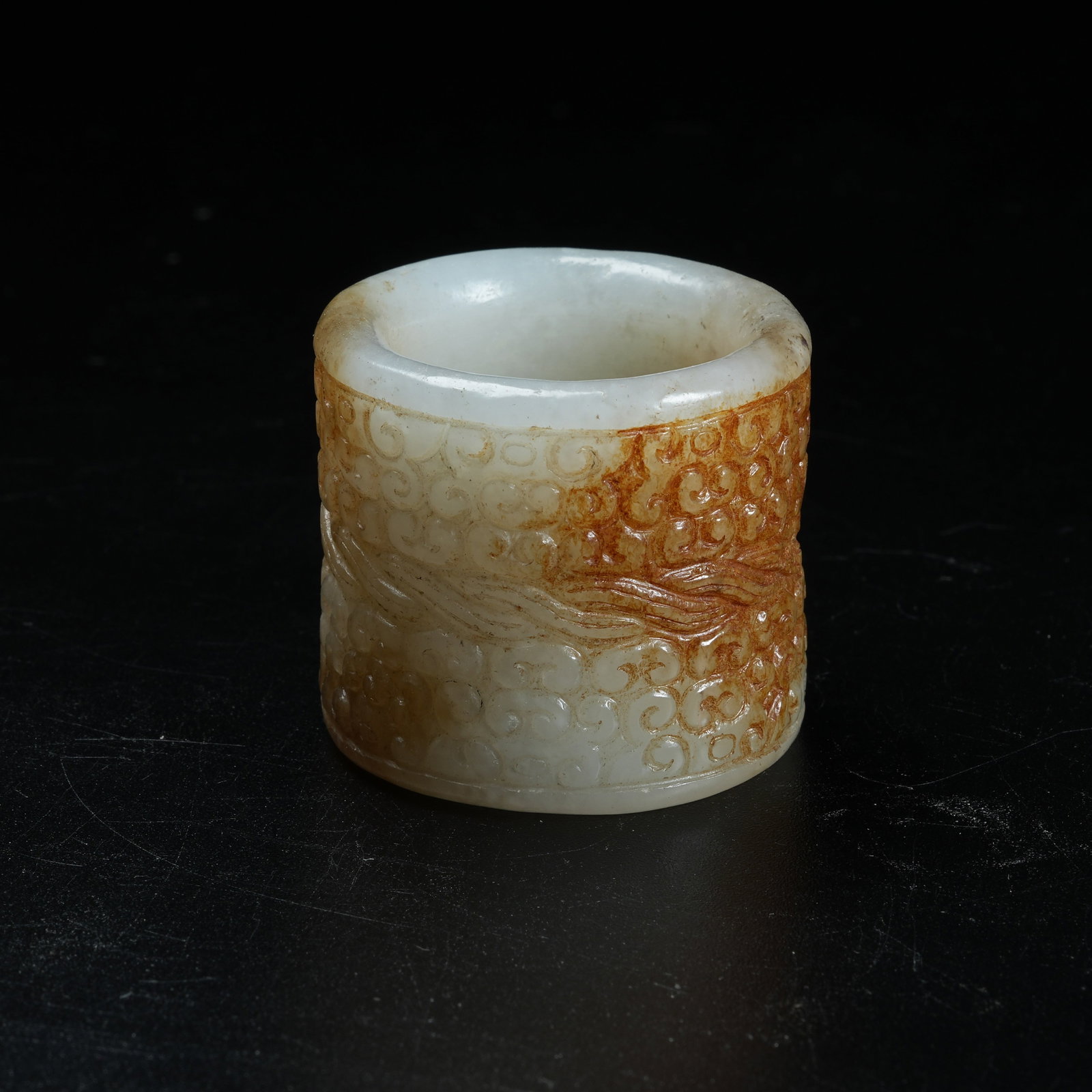 A ANCIENT JADE ARCHER'S RING CARVED WITH HOOKED CLOUD PATTERNS: Ancient Jade Archer's Ring Carved with Hooked Cloud Patterns