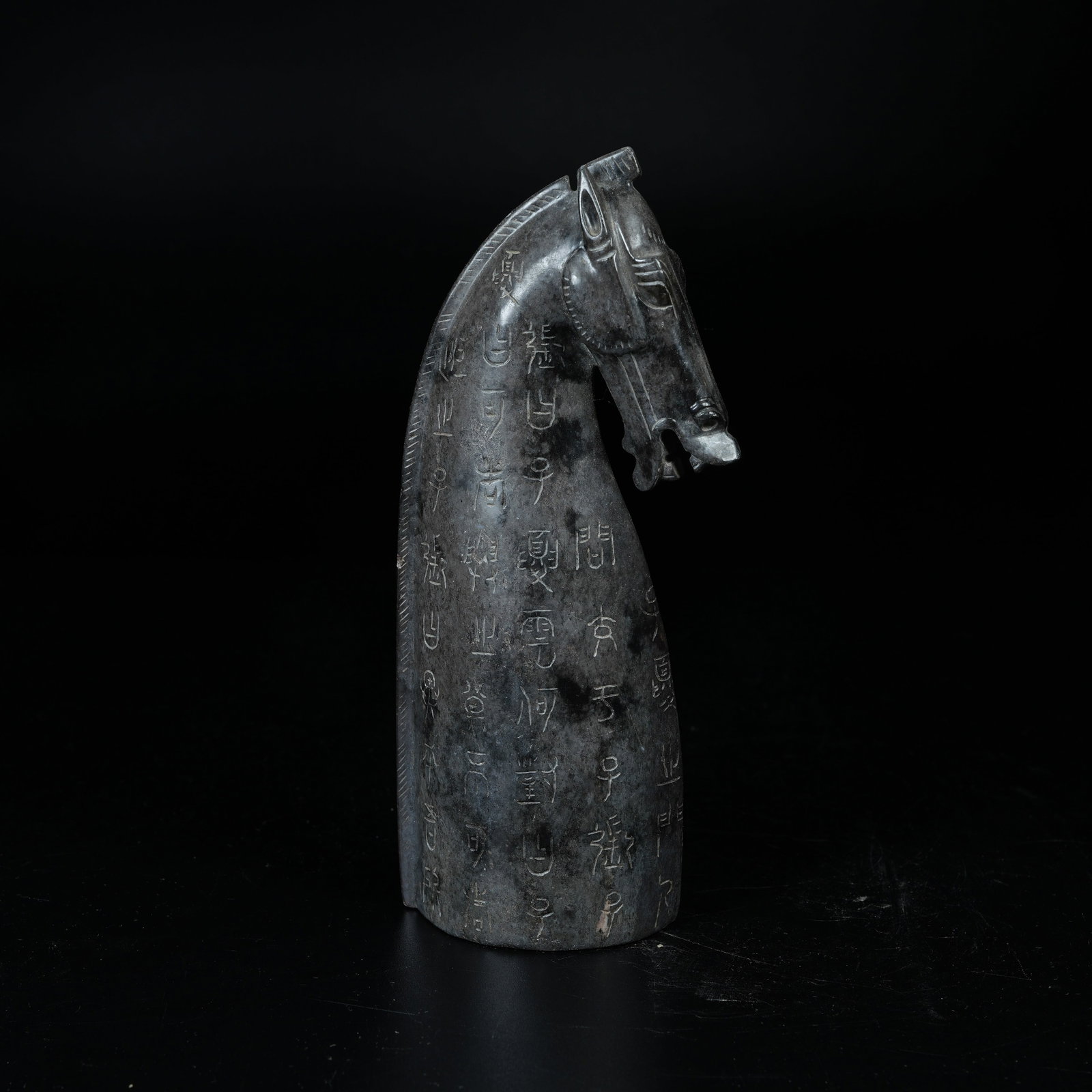 A ARCHAIC JADE HORSE HEAD CARVED WITH INSCRIPTIONS: Archaic Jade Horse Head Carved with Inscriptions