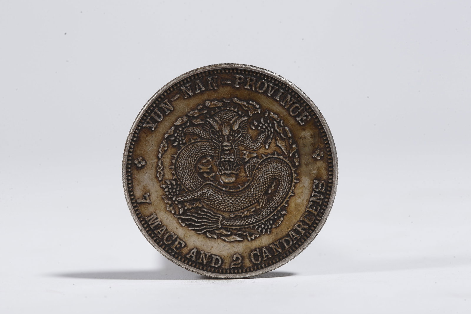 A SILVER DOLLAR COIN - 3