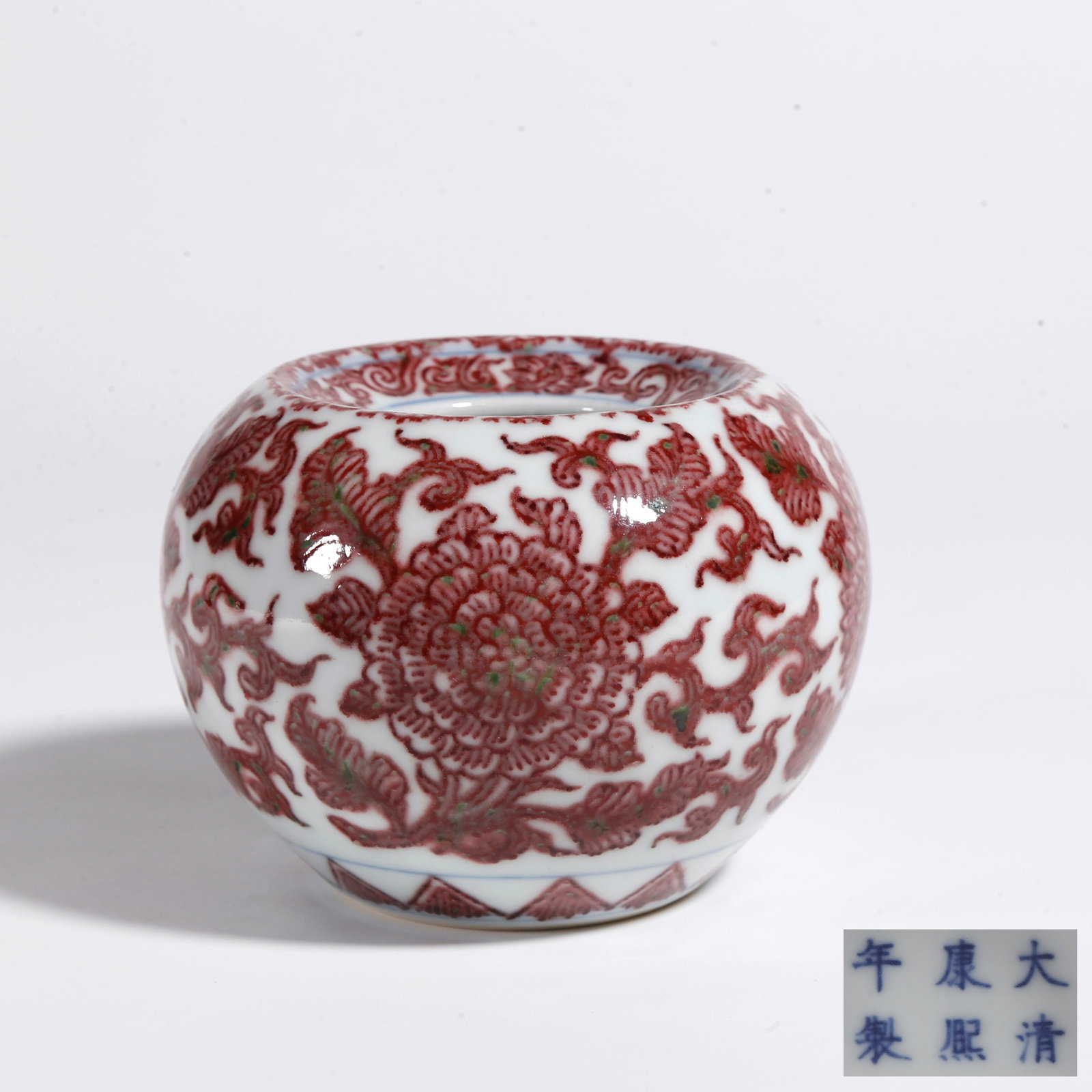 A IRON RED ZUN VESSEL WITH FLORAL PATTERN: Iron Red Zun Vessel with Floral Pattern