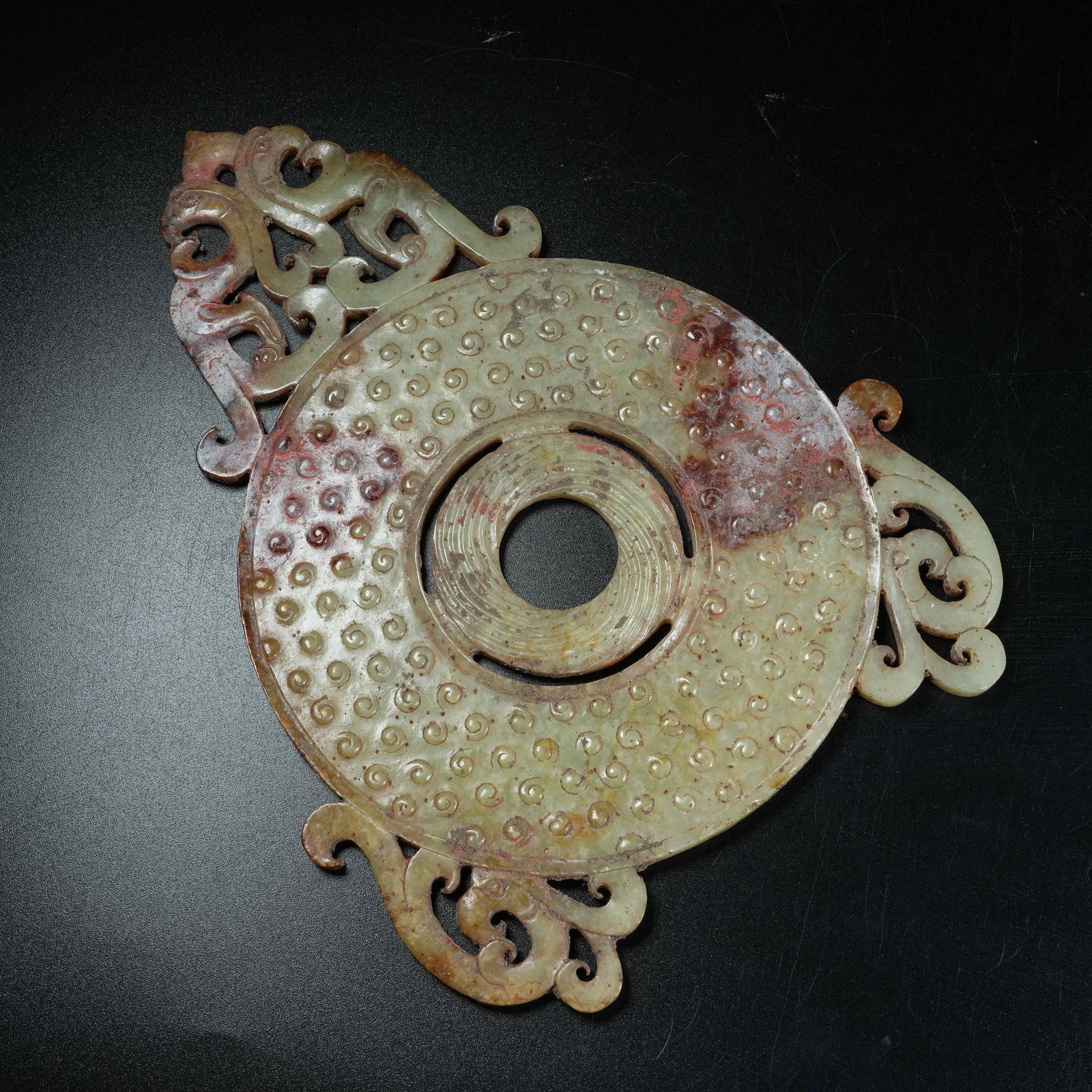 A ANCIENT JADE OPENWORK BI DISC CARVED WITH PHOENIX PATTERNS EXTENDING BEYOND RIM (1 of 7)