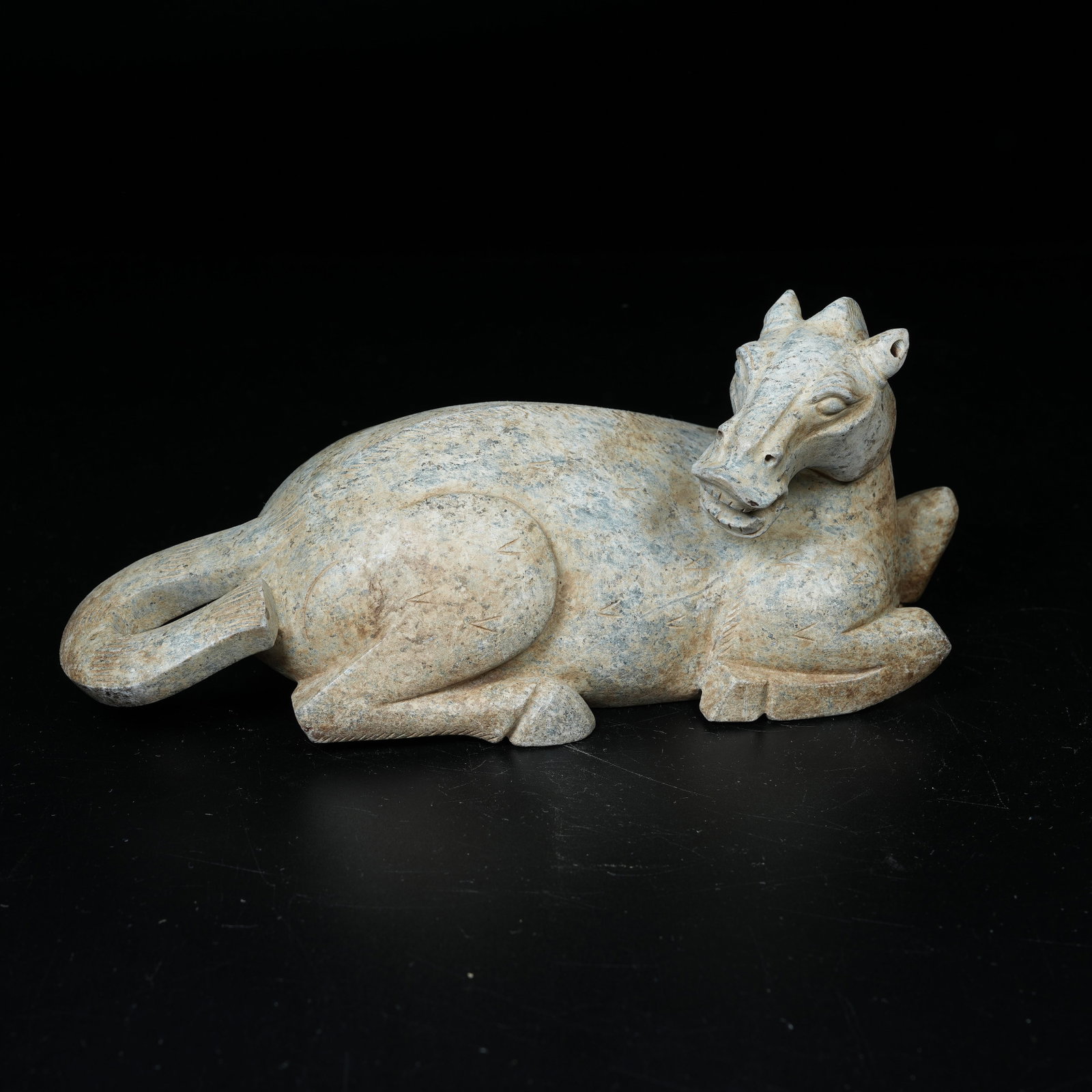 A ARCHAIC JADE RECUMBENT HORSE ORNAMENT: Archaic Jade Recumbent Horse Ornament