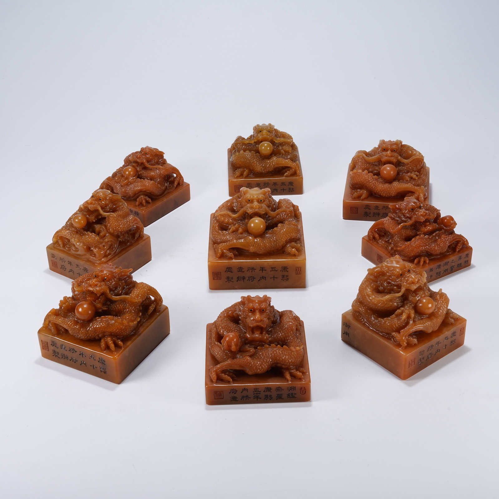 A GROUP OF SHOUSHAN STONE SEALS WITH DRAGON KNOBS: Group of Shoushan Stone Seals with Dragon Knobs