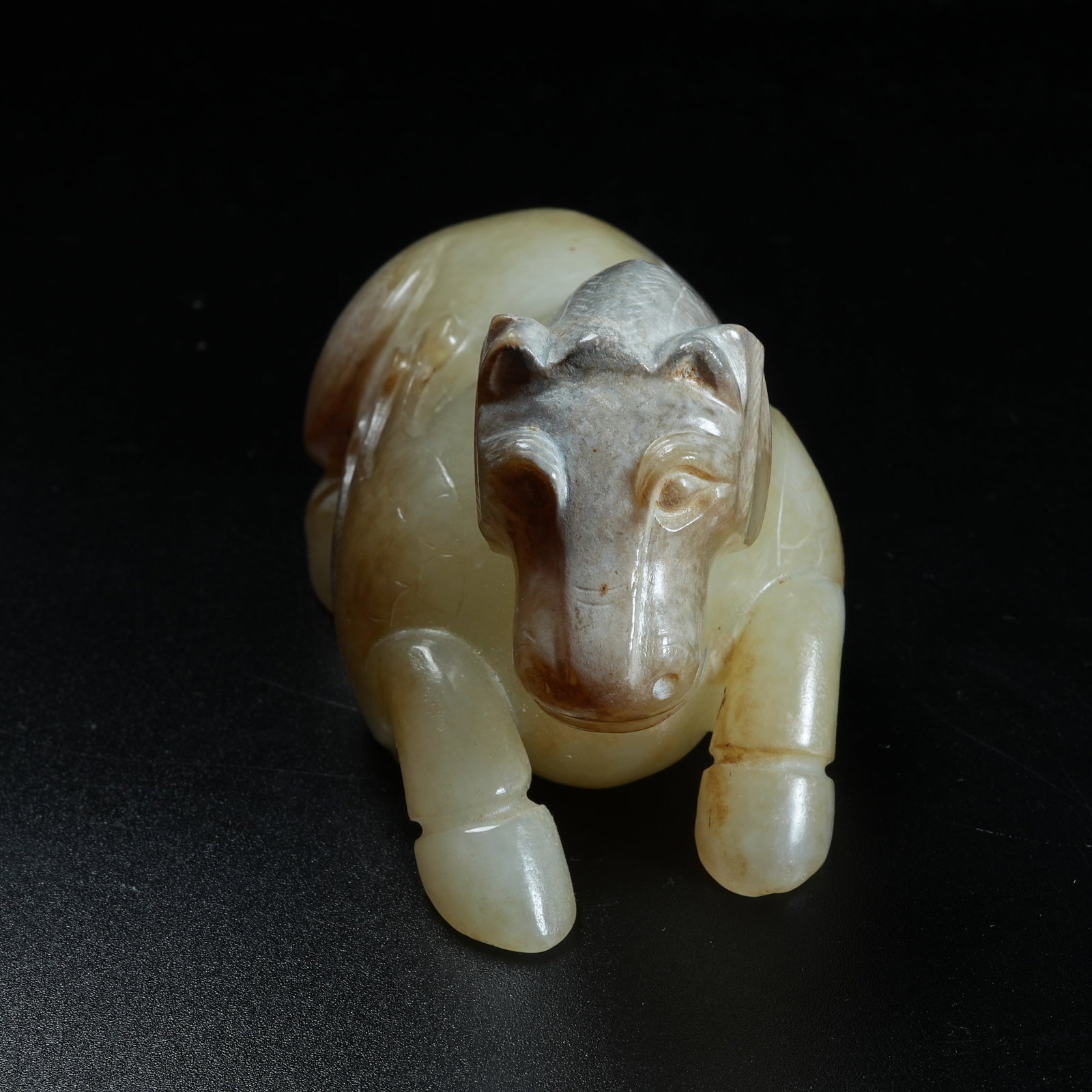 A ARCHAIC JADE RECUMBENT HORSE ORNAMENT: Archaic Jade Recumbent Horse Ornament
