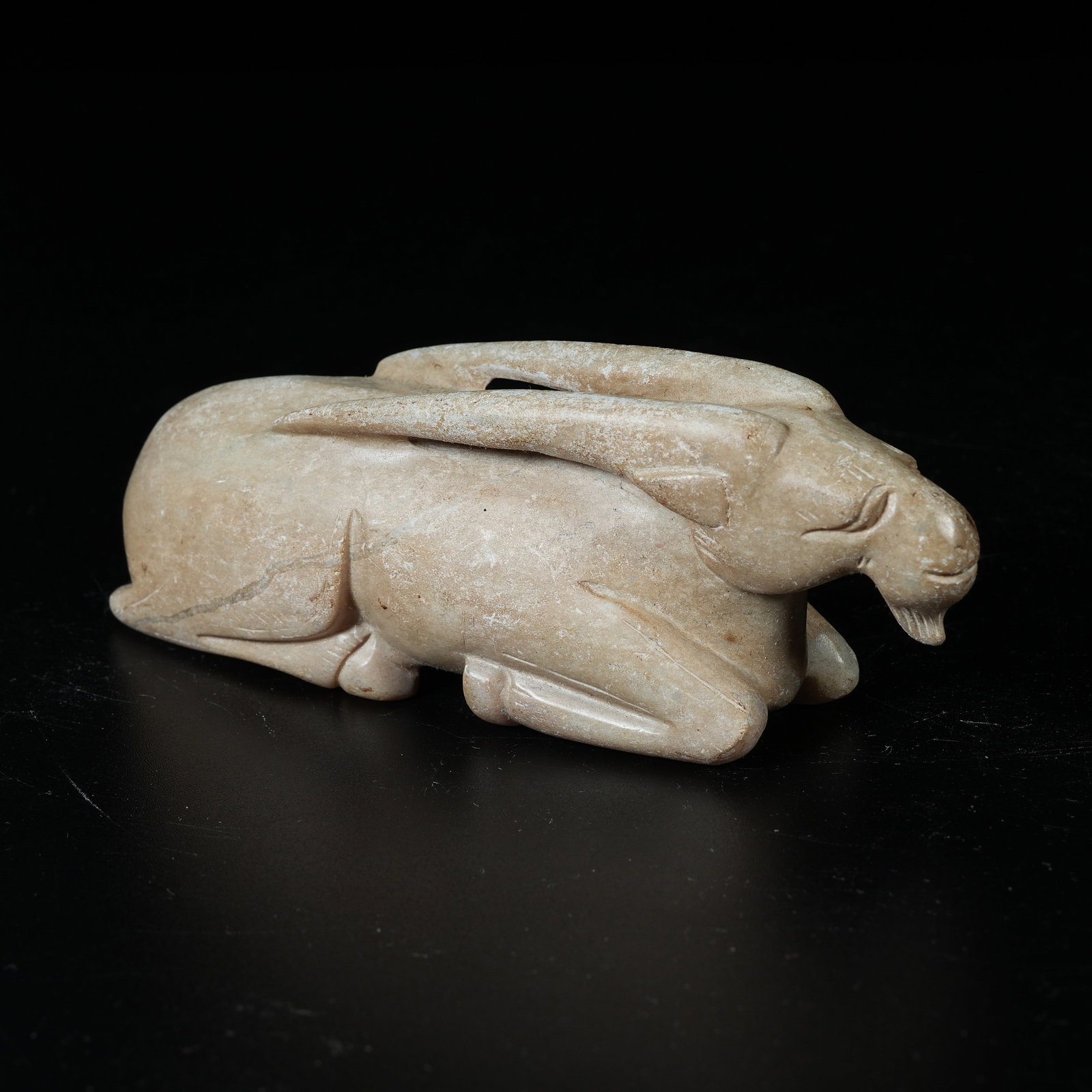 A ARCHAIC JADE RECUMBENT SHEEP ORNAMENT (1 of 8)